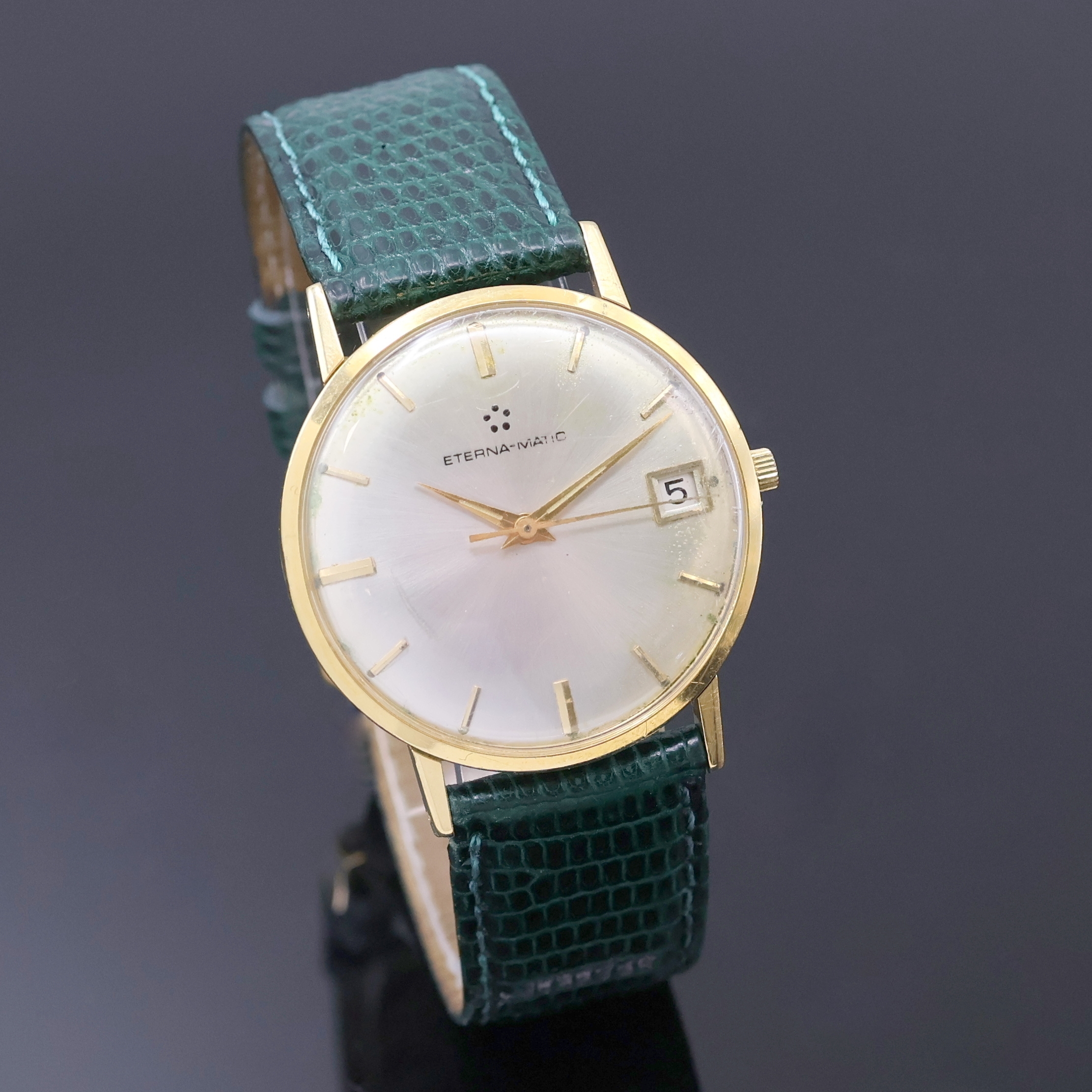 Detail b: ETERNA-MATIC Armbanduhr in GG 750/000, Schweiz um 1965, Automatik, Boden u. Glasrand aufgedr., silb. Zifferbl. teils berieben/pat., gold. Std.-Ind. ...