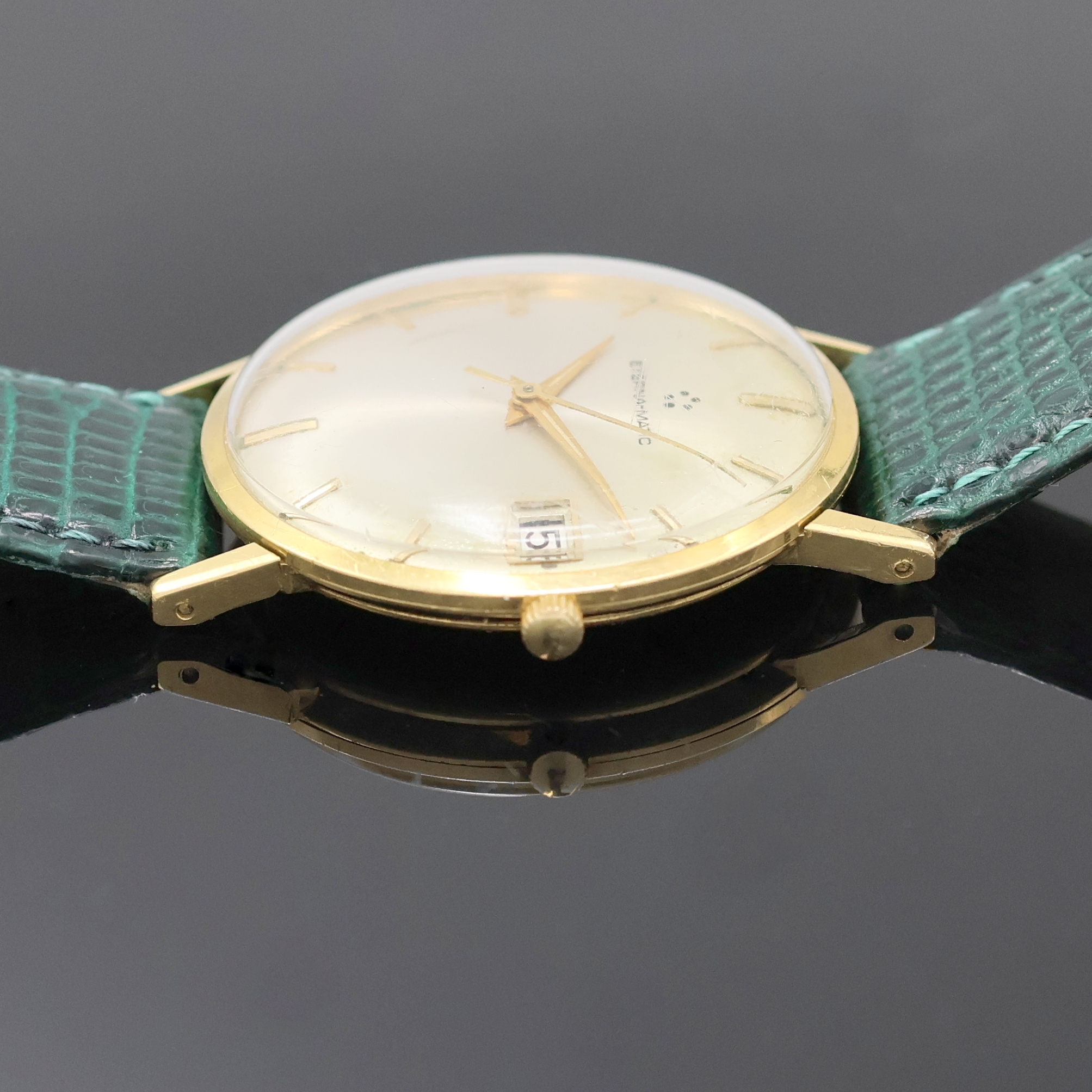 Detail c: ETERNA-MATIC Armbanduhr in GG 750/000, Schweiz um 1965, Automatik, Boden u. Glasrand aufgedr., silb. Zifferbl. teils berieben/pat., gold. Std.-Ind. ...