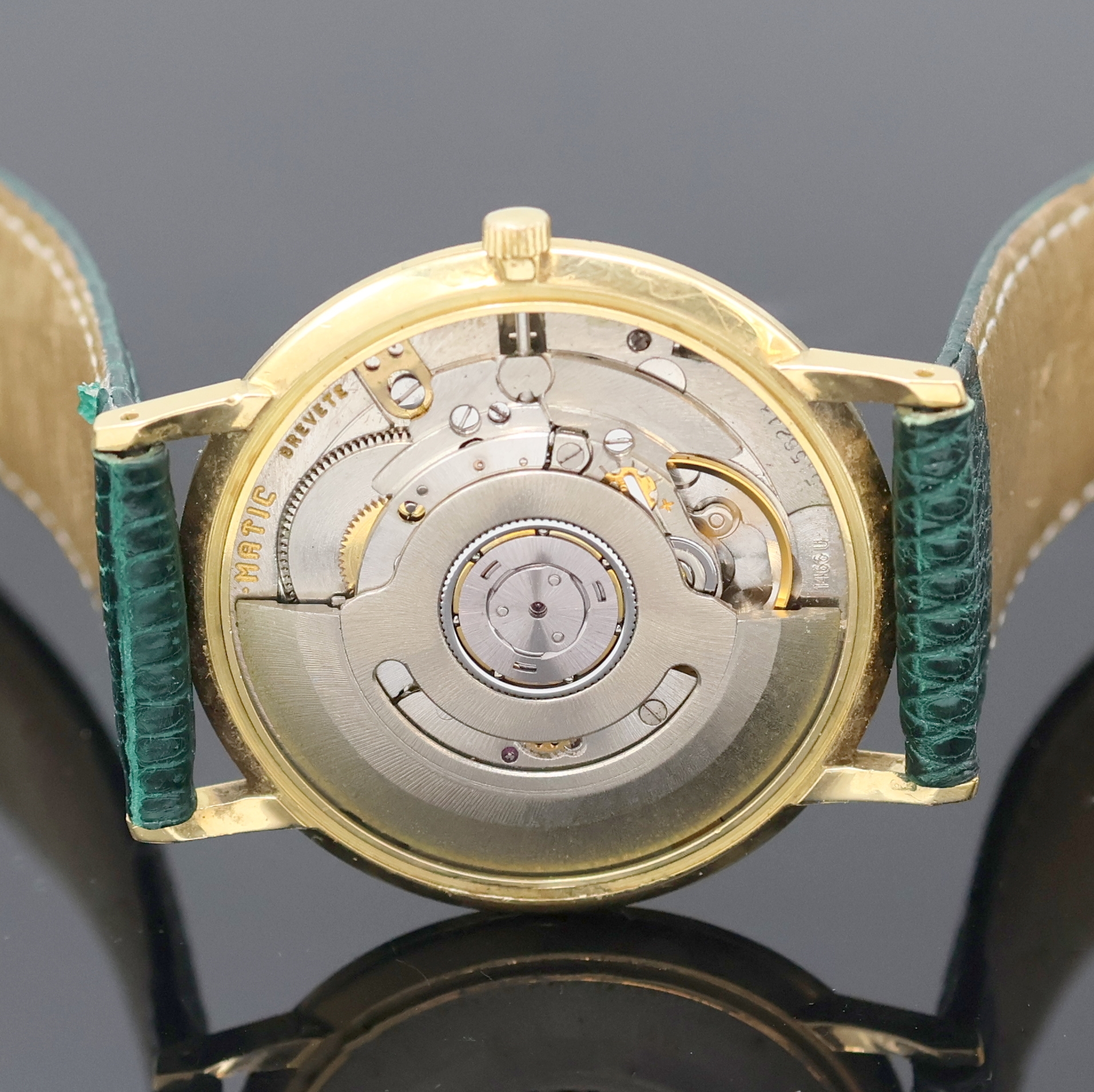 Detail e: ETERNA-MATIC Armbanduhr in GG 750/000, Schweiz um 1965, Automatik, Boden u. Glasrand aufgedr., silb. Zifferbl. teils berieben/pat., gold. Std.-Ind. ...