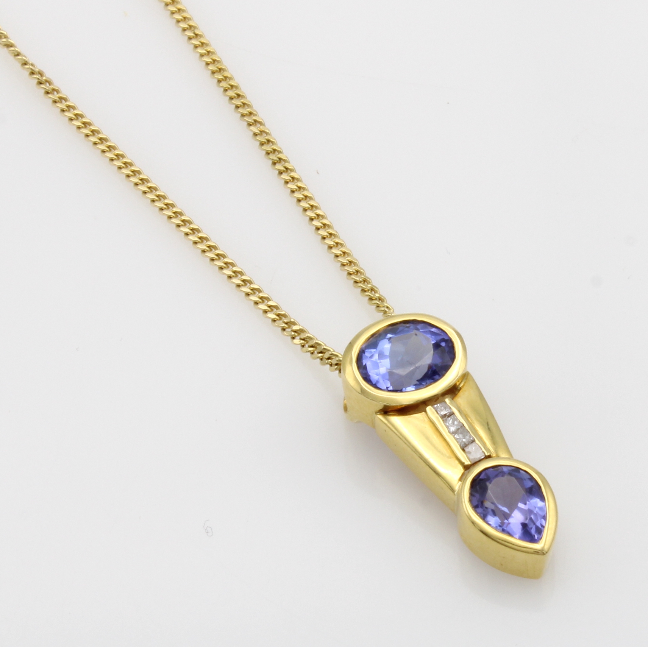 Image 27040865 - Anhänger mit Tansaniten und Diamanten an Kette, GG 750/000, 2 Tansanite zus. ca. 2.54 ...