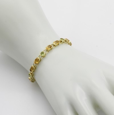 27041164a - Armband mit Peridots und Citrinen, GG 585/ 000, ovale u. runde Farbsteine zus. ca. 6 ct, ...