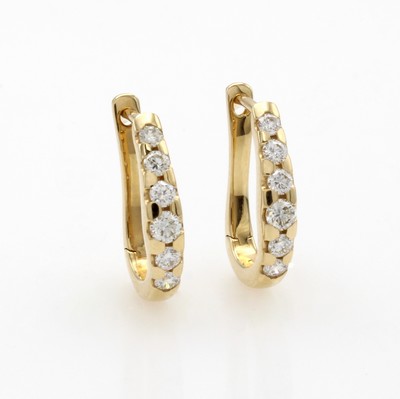 27041987a - Paar Creolen mit Brillanten, GG 585/000, ovale Form, 12 Brill. zus. ca. 0.50 ct Weiß/ ...