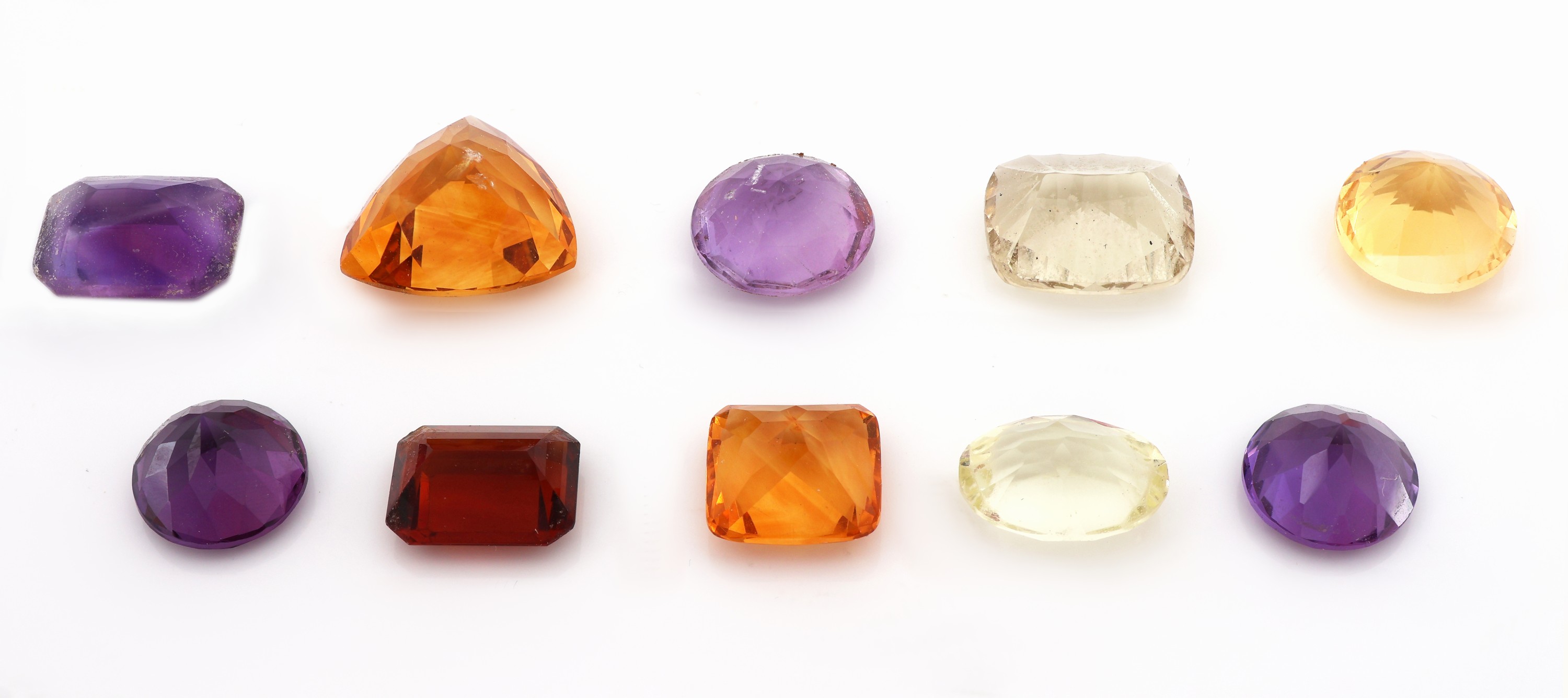 Detail a: Lot lose Farbsteine, zus. ca. 60.53 ct, Citrine und Amethyste, versch. Schliffformen, Größen, Ausfassware