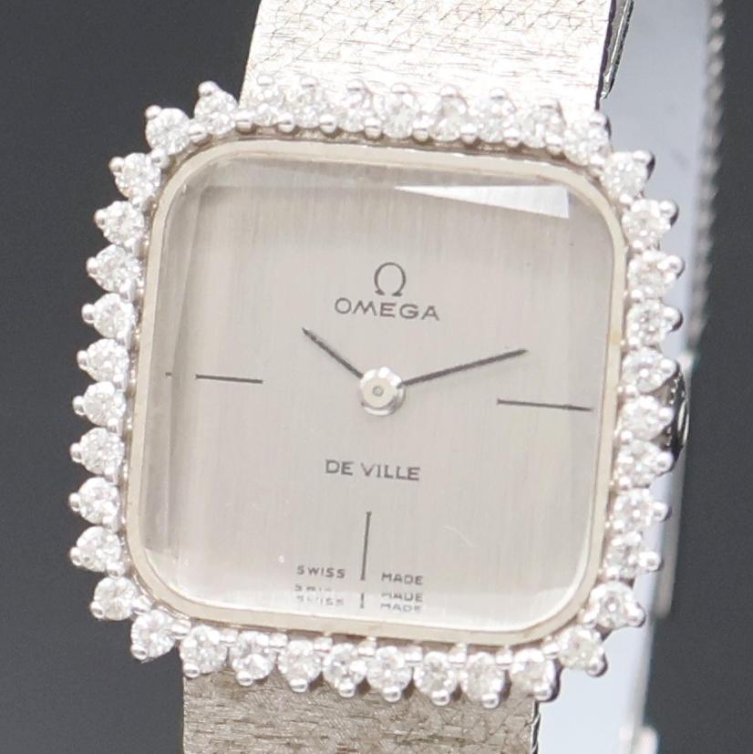 Detail a: OMEGA De Ville Damenarmbanduhr in WG 750/000 Referenz 1211, Handaufzug, Schweiz um 1969, 2-teil. Geh. inkl. orig. Milanaiseband, Boden aufgedr., ...