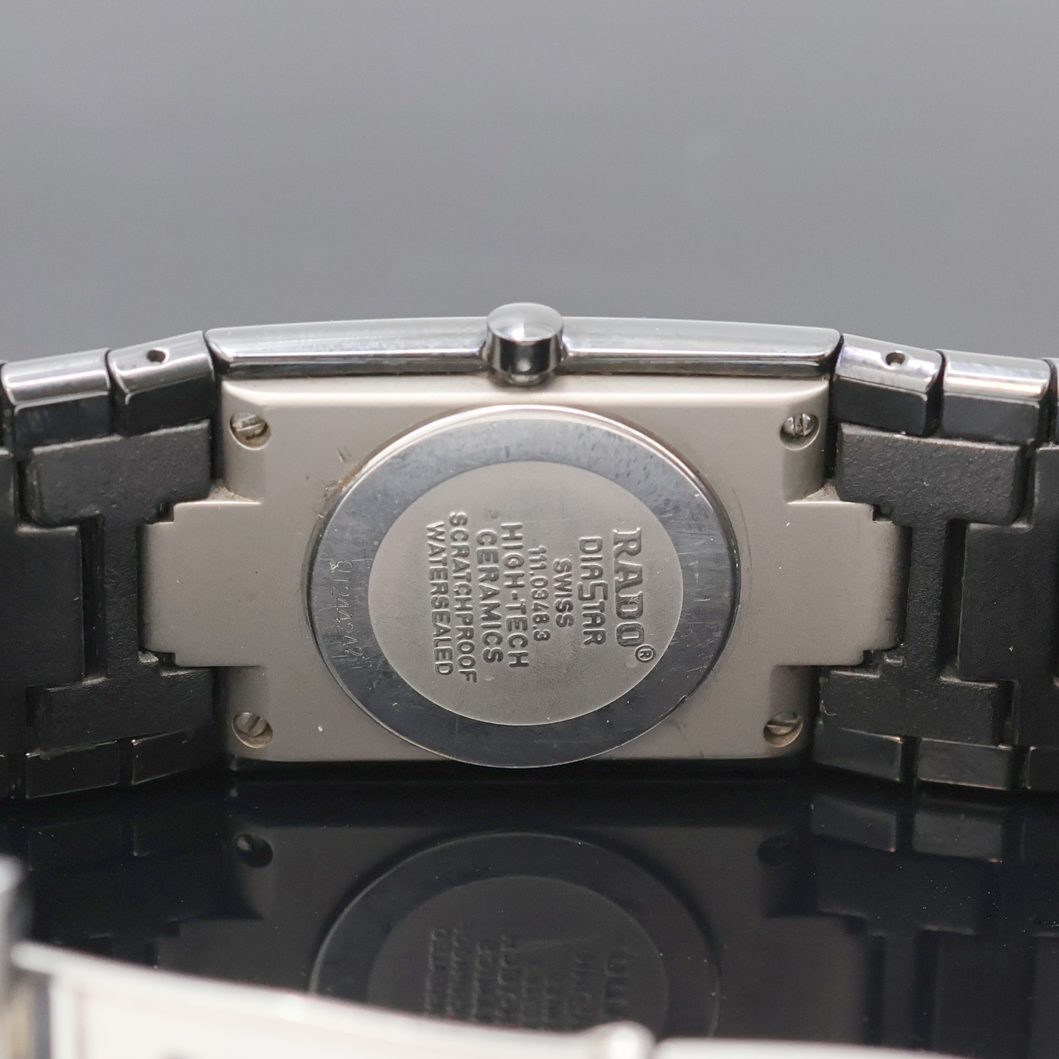 Detail e: RADO Jubilé Armbanduhr Serie Diastar Referenz 111.0348.3, Schweiz um 1995, quarz, schwarzes Keramikgeh. inkl. Gliederband m. dopp. Faltschl., ...