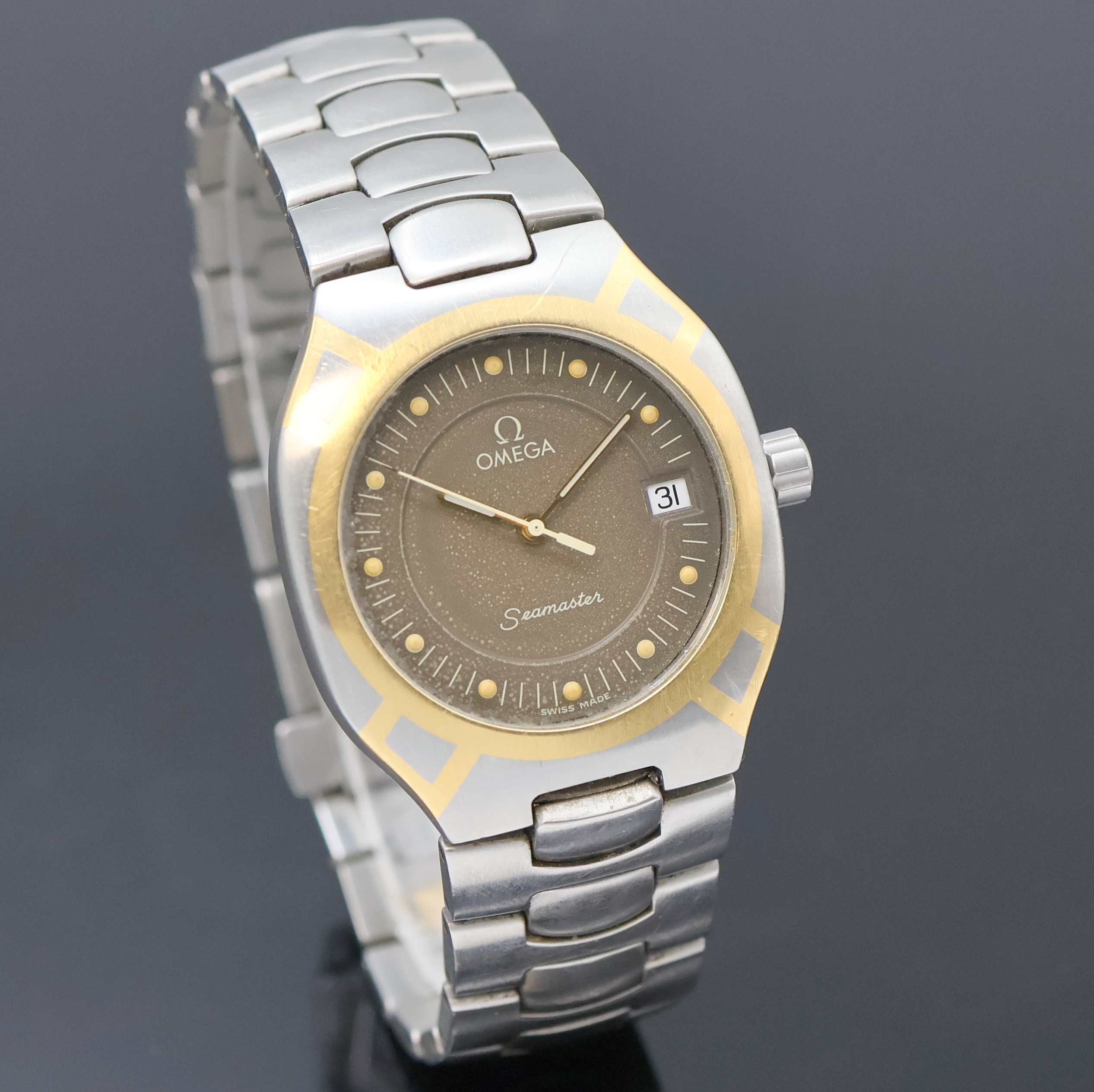 Detail b: OMEGA Seamaster Polaris Armbanduhr Referenz 396.1022/396.1222, Schweiz um 1990, quarz, Edelstahlgeh. GG intarsiert, orig. Gliederband m. Faltschl., ...