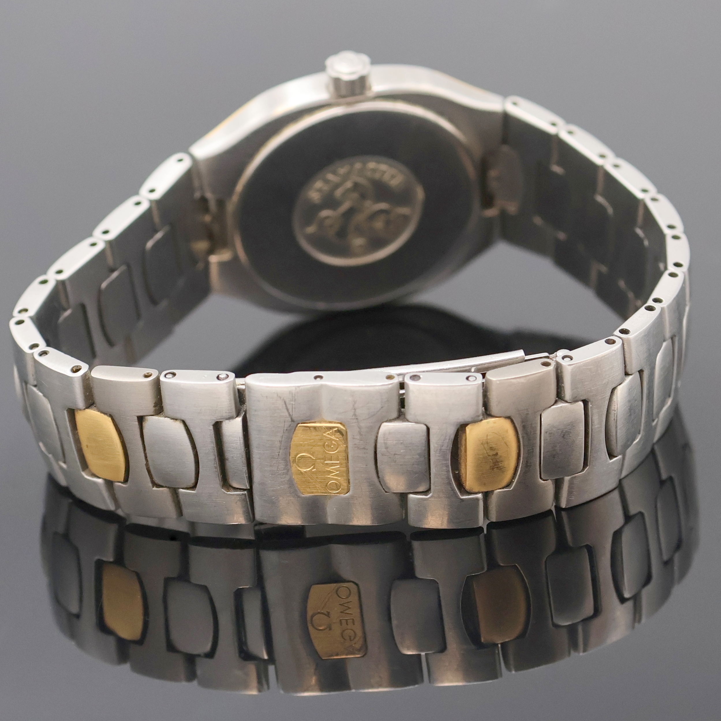 Detail c: OMEGA Seamaster Polaris Armbanduhr Referenz 396.1022/396.1222, Schweiz um 1990, quarz, Edelstahlgeh. GG intarsiert, orig. Gliederband m. Faltschl., ...