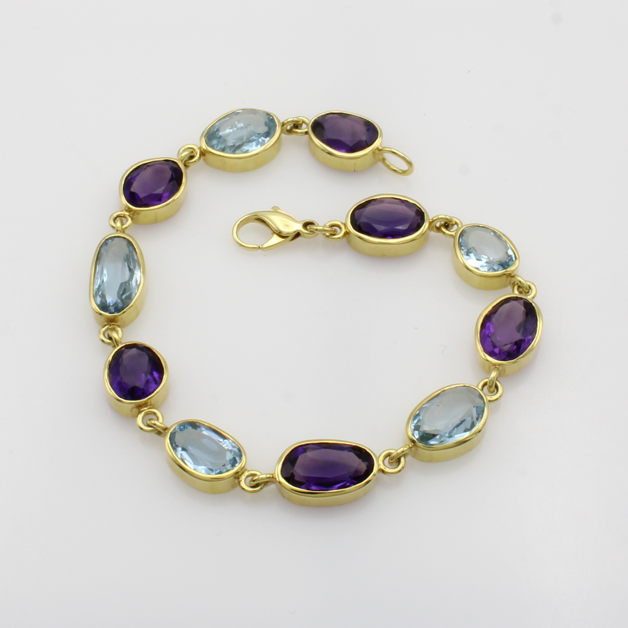Image 27046460 - Gliederarmband mit Amethysten und Aquamarinen, GG 585/000, Farbsteine in versch. Formen ...
