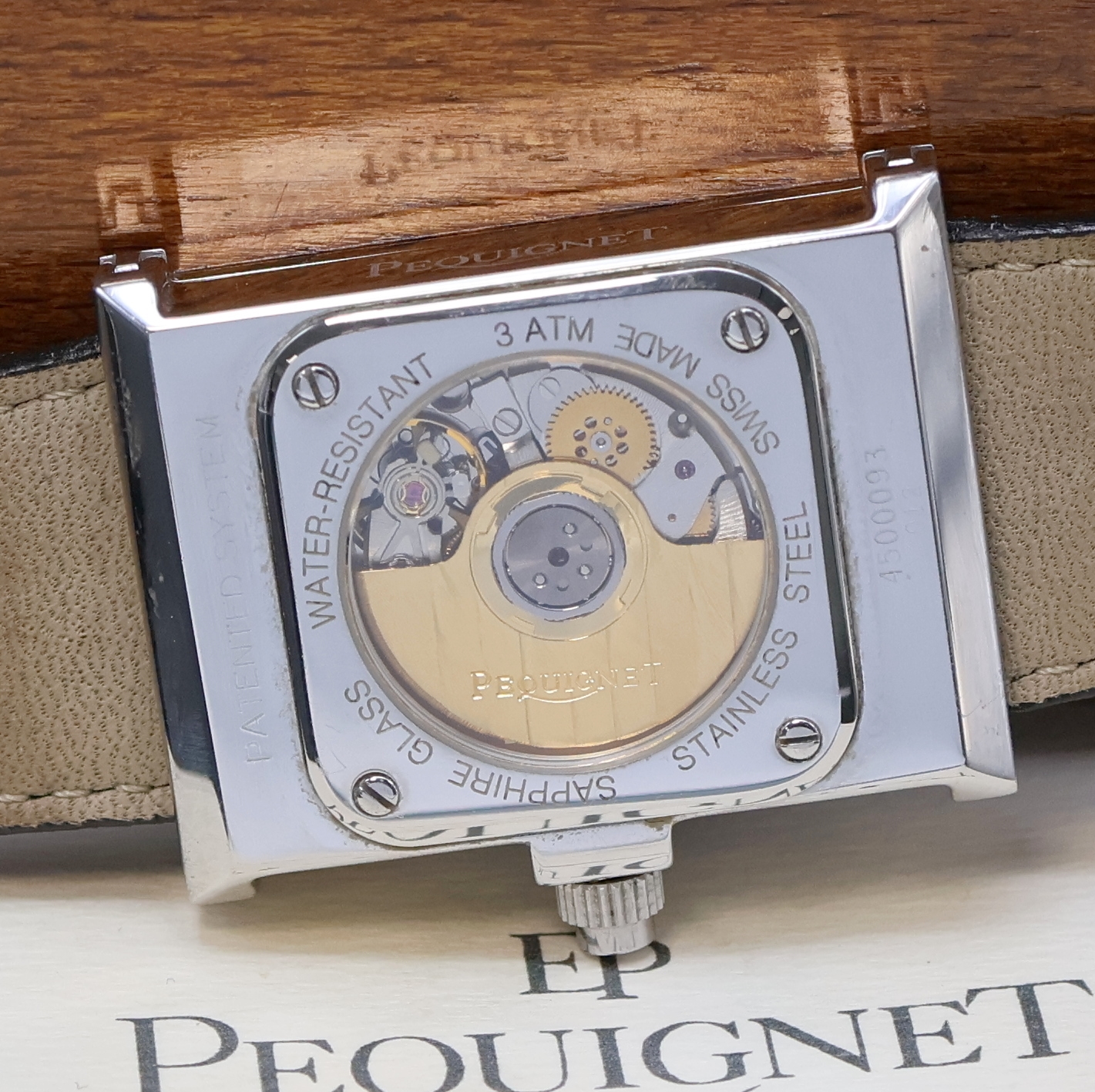 Detail g: PEQUINET Cameleone Armbanduhr in Stahl, Schweiz verk. lt. beil. Pap. 03/1996, Automatik, beids. vergl. Stahlgeh., Boden 4-fach verschr., orig. ...