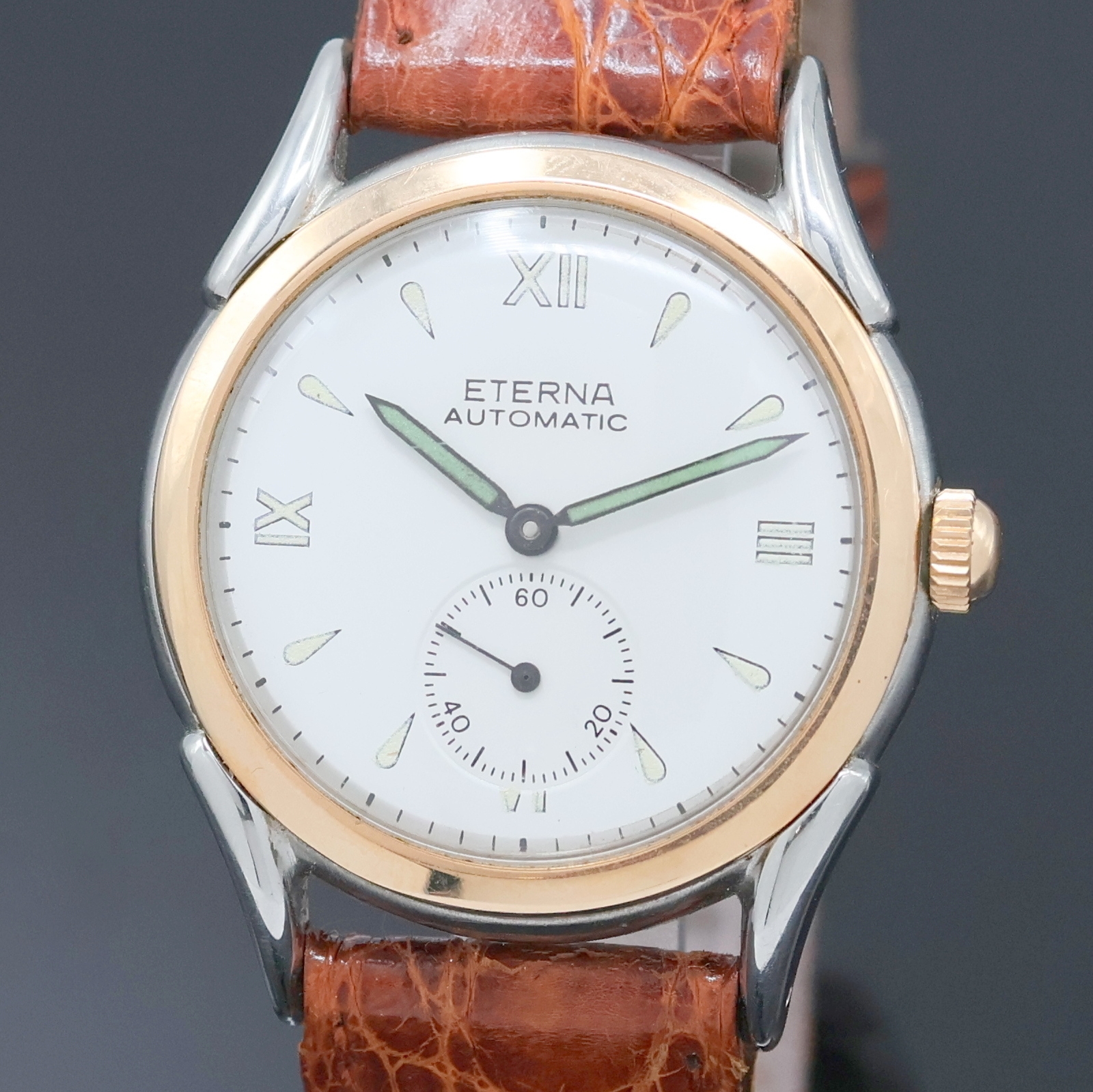 Detail a: ETERNA Armbanduhr mit Hammerautomatik in Stahl, Schweiz um 1945, Automatik, Boden verschr., verg. Lünette, silb. Zifferbl. rest., Leuchtind., ...
