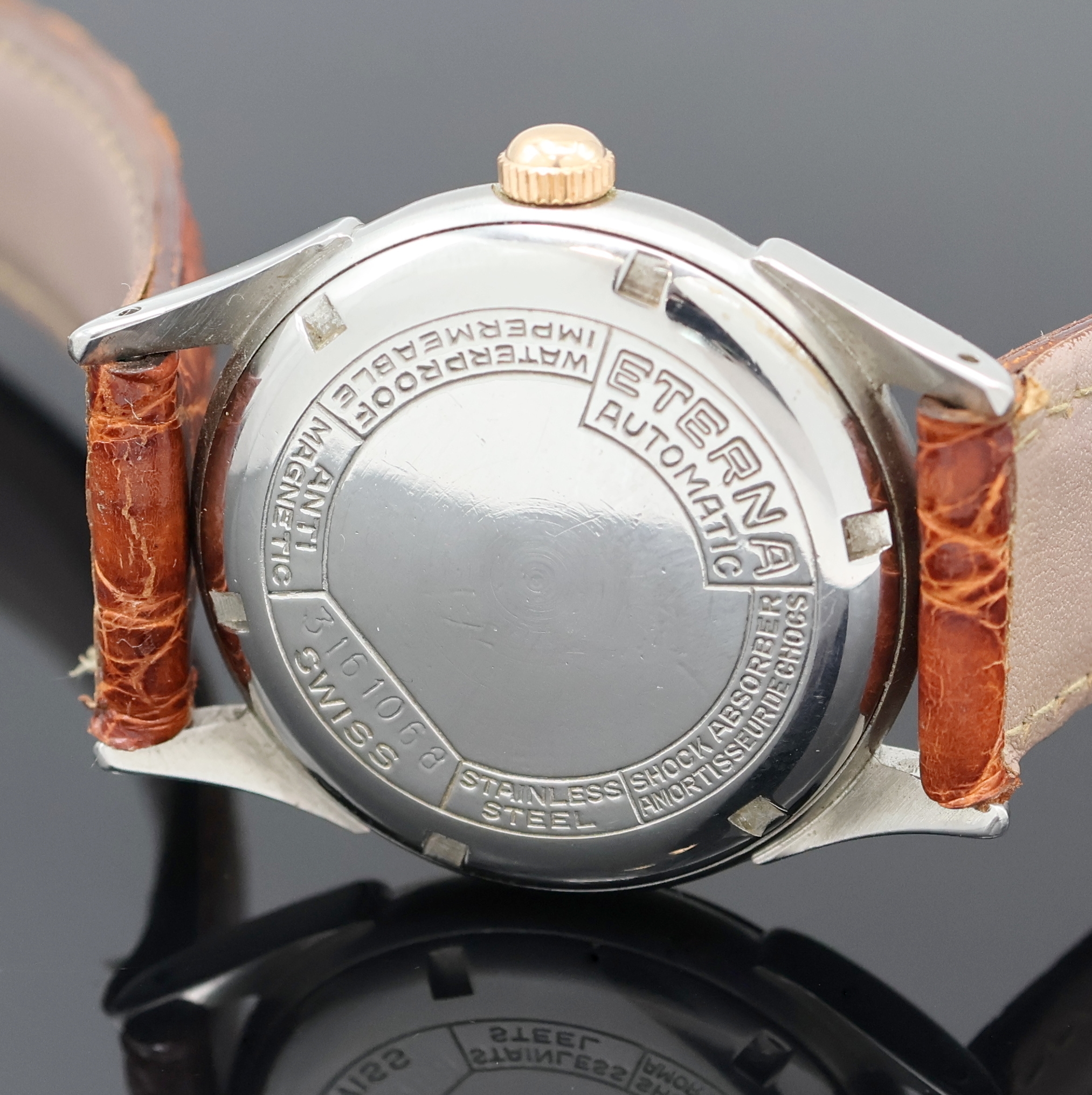 Detail d: ETERNA Armbanduhr mit Hammerautomatik in Stahl, Schweiz um 1945, Automatik, Boden verschr., verg. Lünette, silb. Zifferbl. rest., Leuchtind., ...