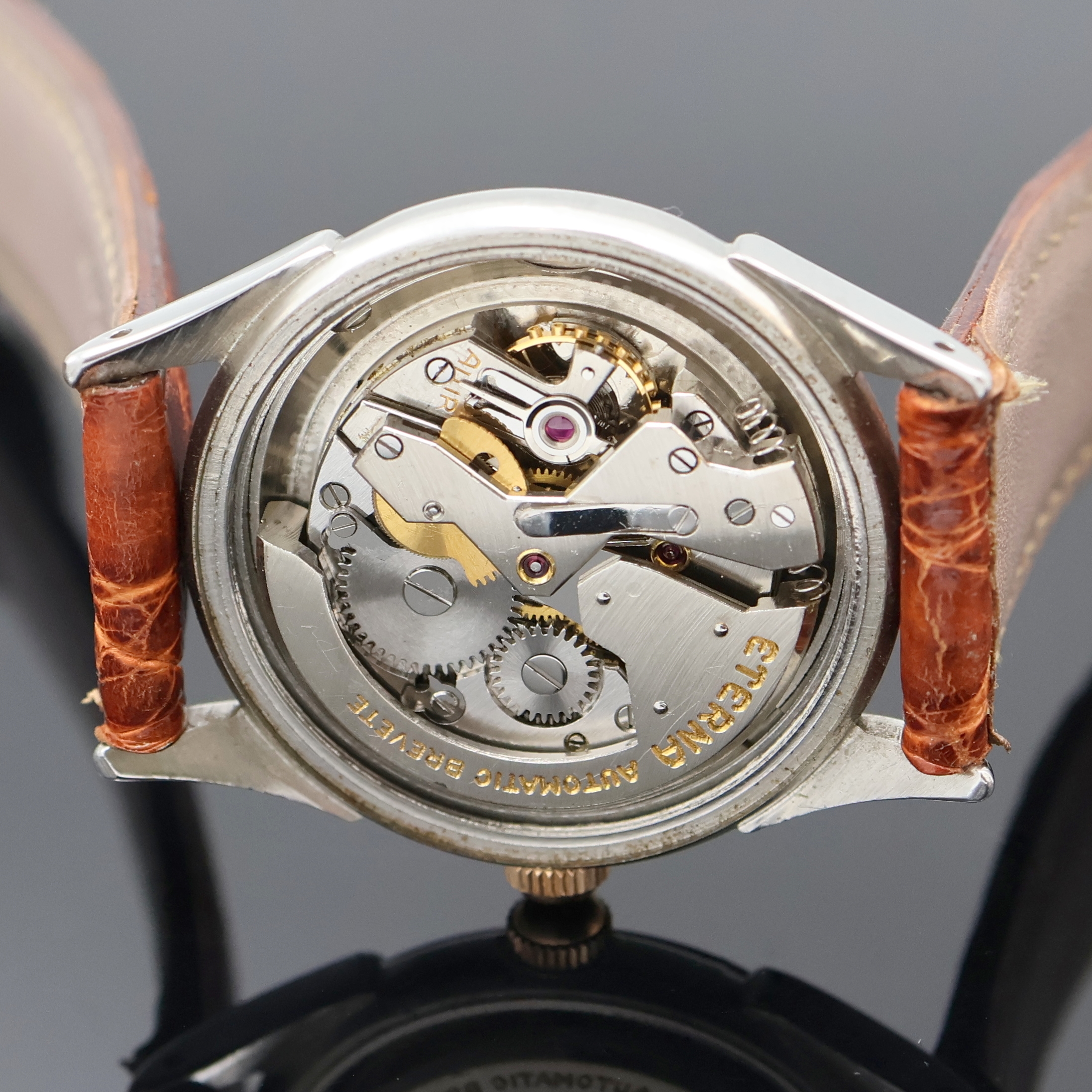 Detail f: ETERNA Armbanduhr mit Hammerautomatik in Stahl, Schweiz um 1945, Automatik, Boden verschr., verg. Lünette, silb. Zifferbl. rest., Leuchtind., ...