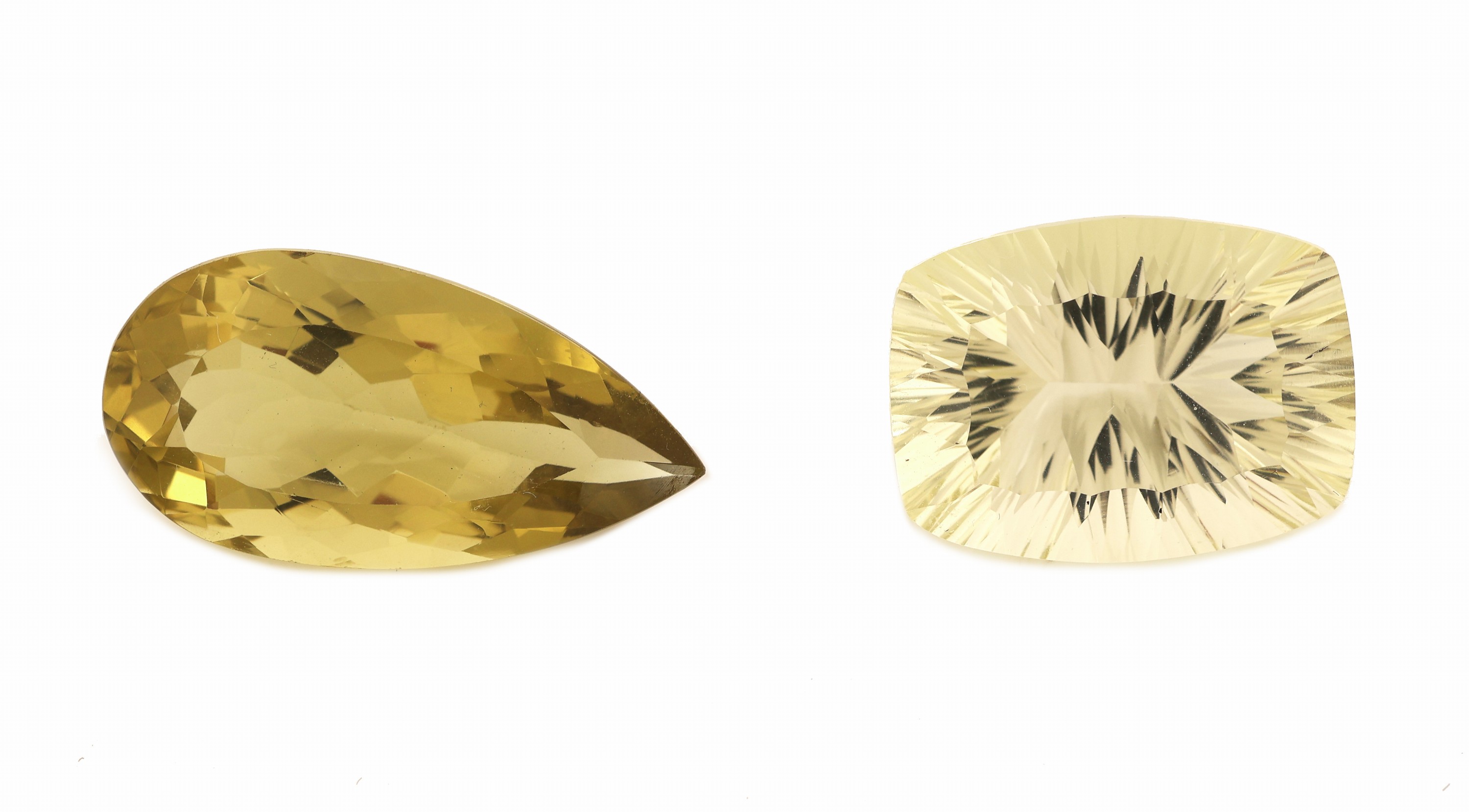 Konvolut 2 lose Citrine, 1 x ca. 18.05 ct, Fantasieschliff, ca. 20.06 x 15.05 x 10.16 mm,und 1 x ca. 17.88 ct, facett. Tropfen, ca. 26.22 x 13.51 x ...