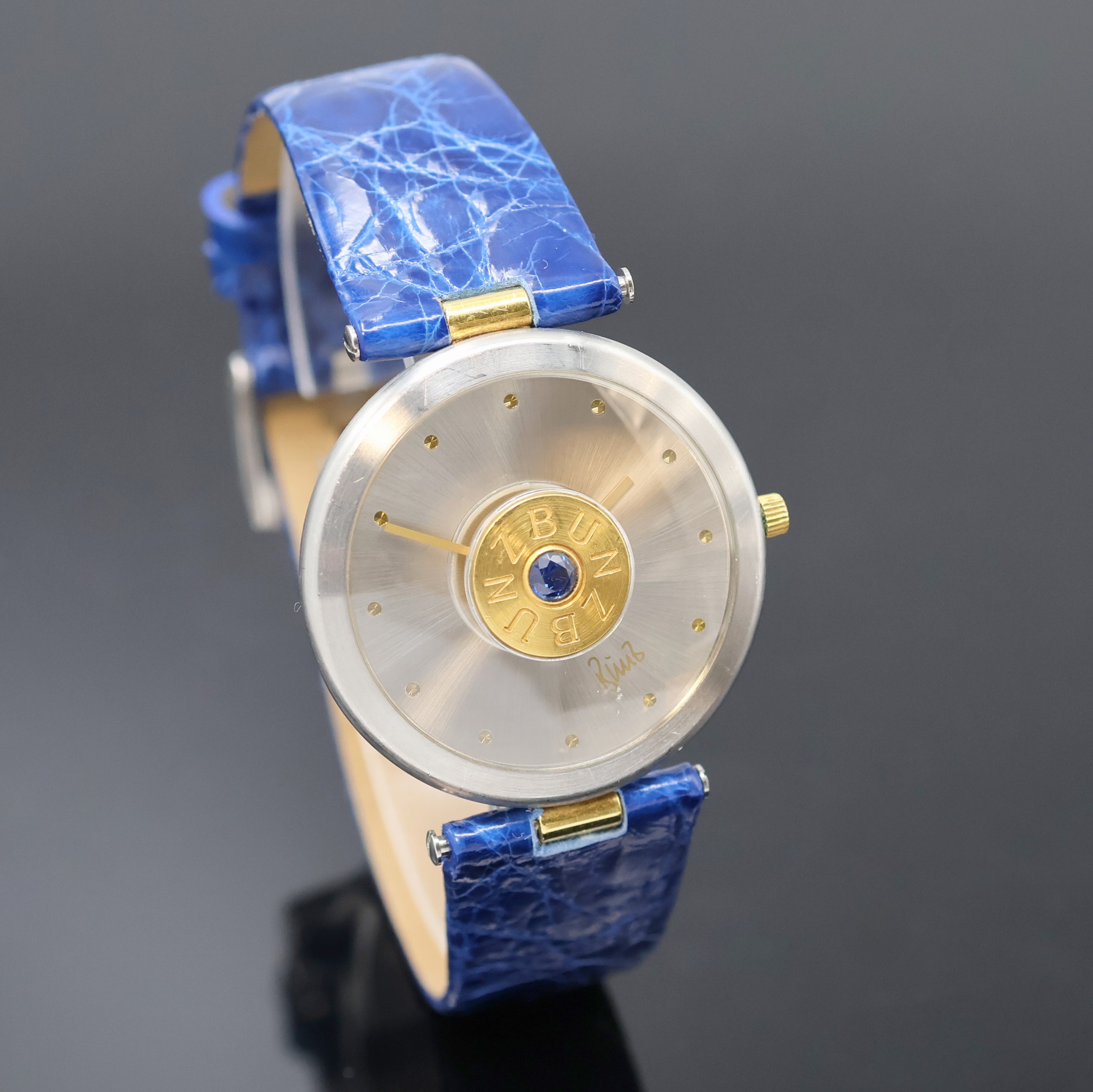 Detail b: BUNZ Design-Armbanduhr Referenz 27010322, Schweiz um 2005, quarz, Edelstahl/Gold inkl. neutr. Lederband m. orig. Dornschl., Boden 6- fach verschr., ...