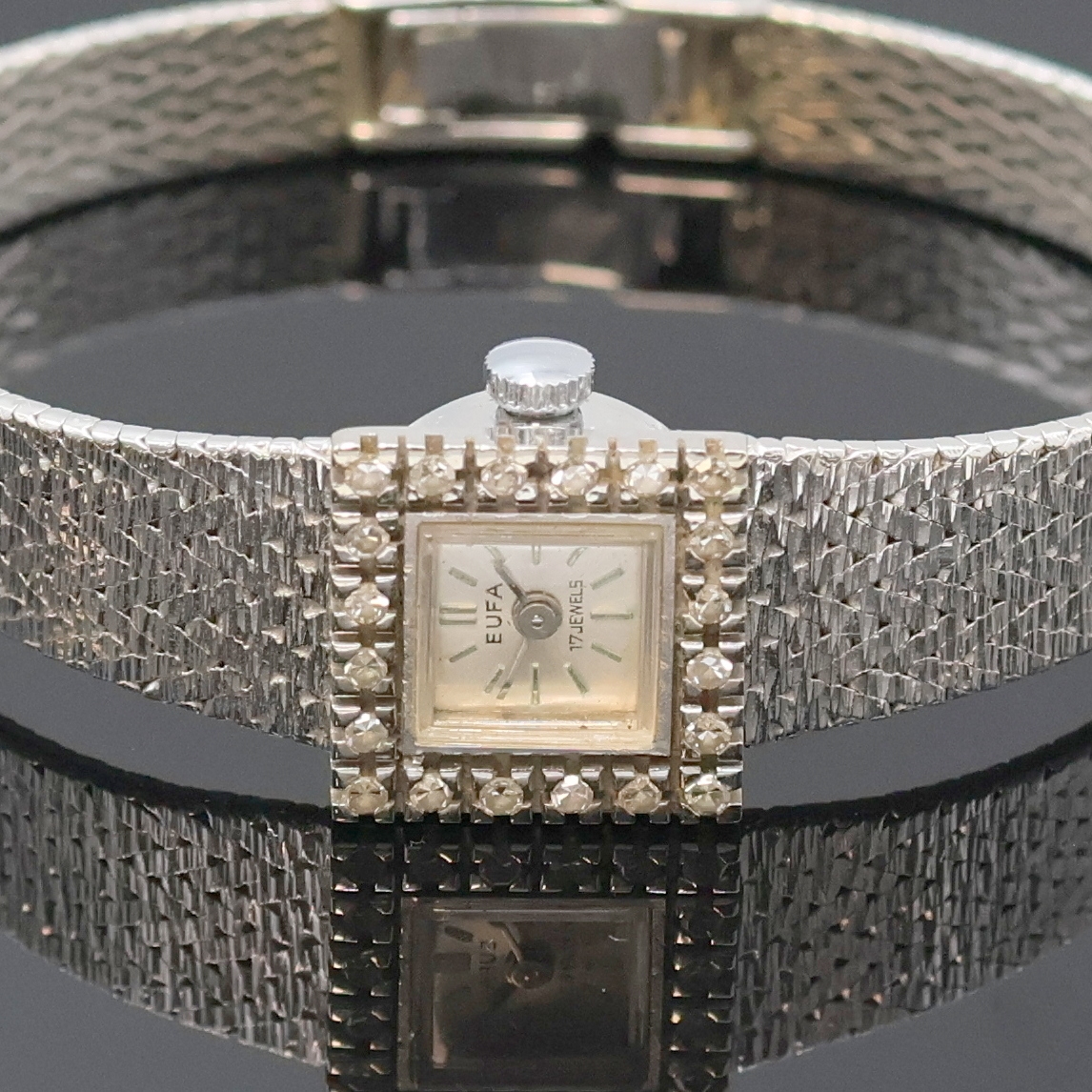 Detail a: EUFA Damenarmbanduhr in WG 585/000 mit Diamanten, Schweiz um 1965, Handaufzug, Goldband, Boden aufgedr., Lünette aufw. m. Diamanten bes., silb. ...