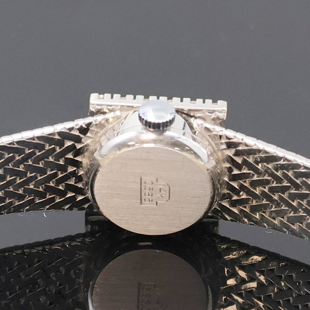 Detail d: EUFA Damenarmbanduhr in WG 585/000 mit Diamanten, Schweiz um 1965, Handaufzug, Goldband, Boden aufgedr., Lünette aufw. m. Diamanten bes., silb. ...