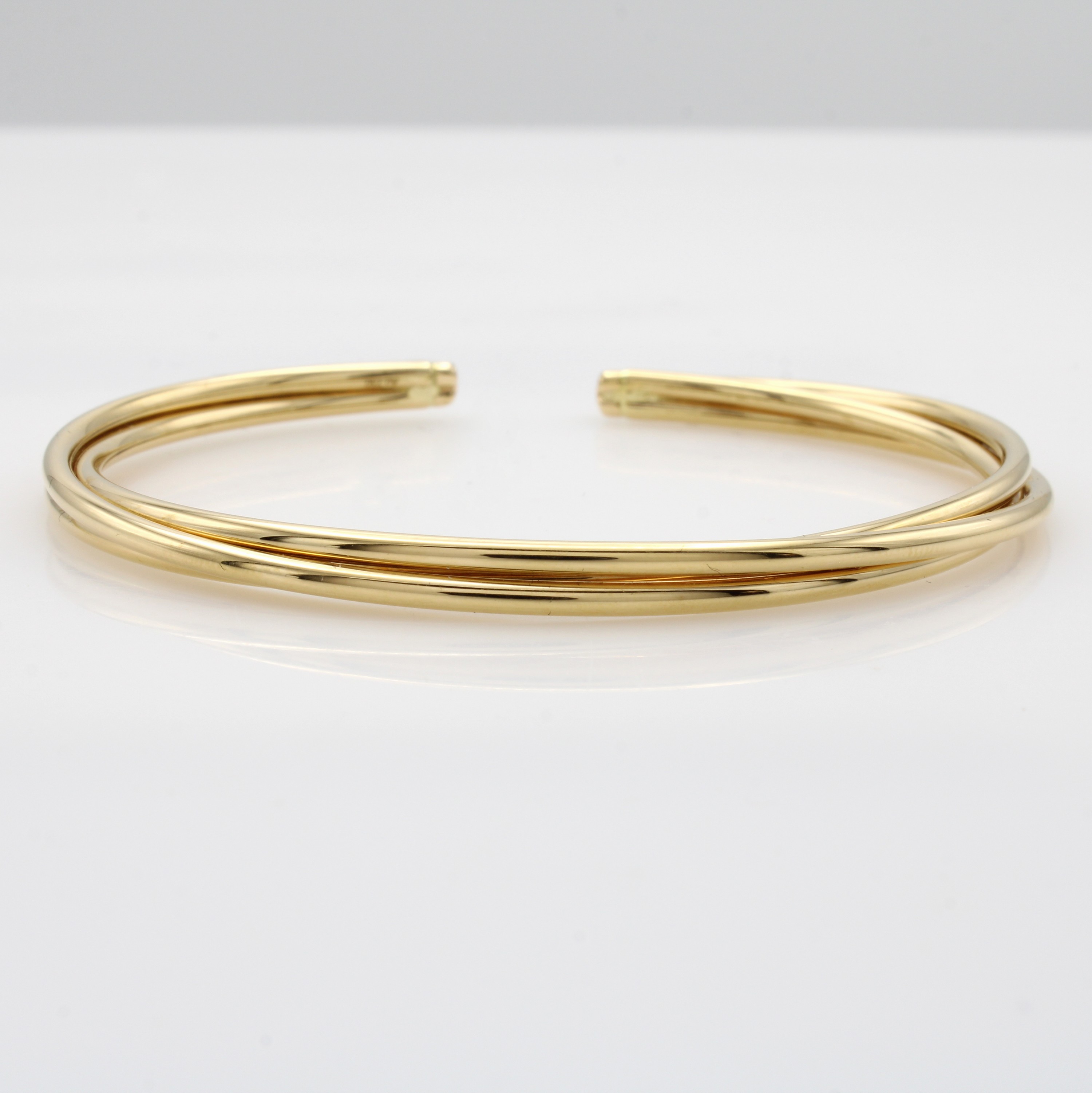 Image 27050651 - 3-reihiger Armreif, GG 750/000, leicht biegsamu. verschlungen gearbeitet