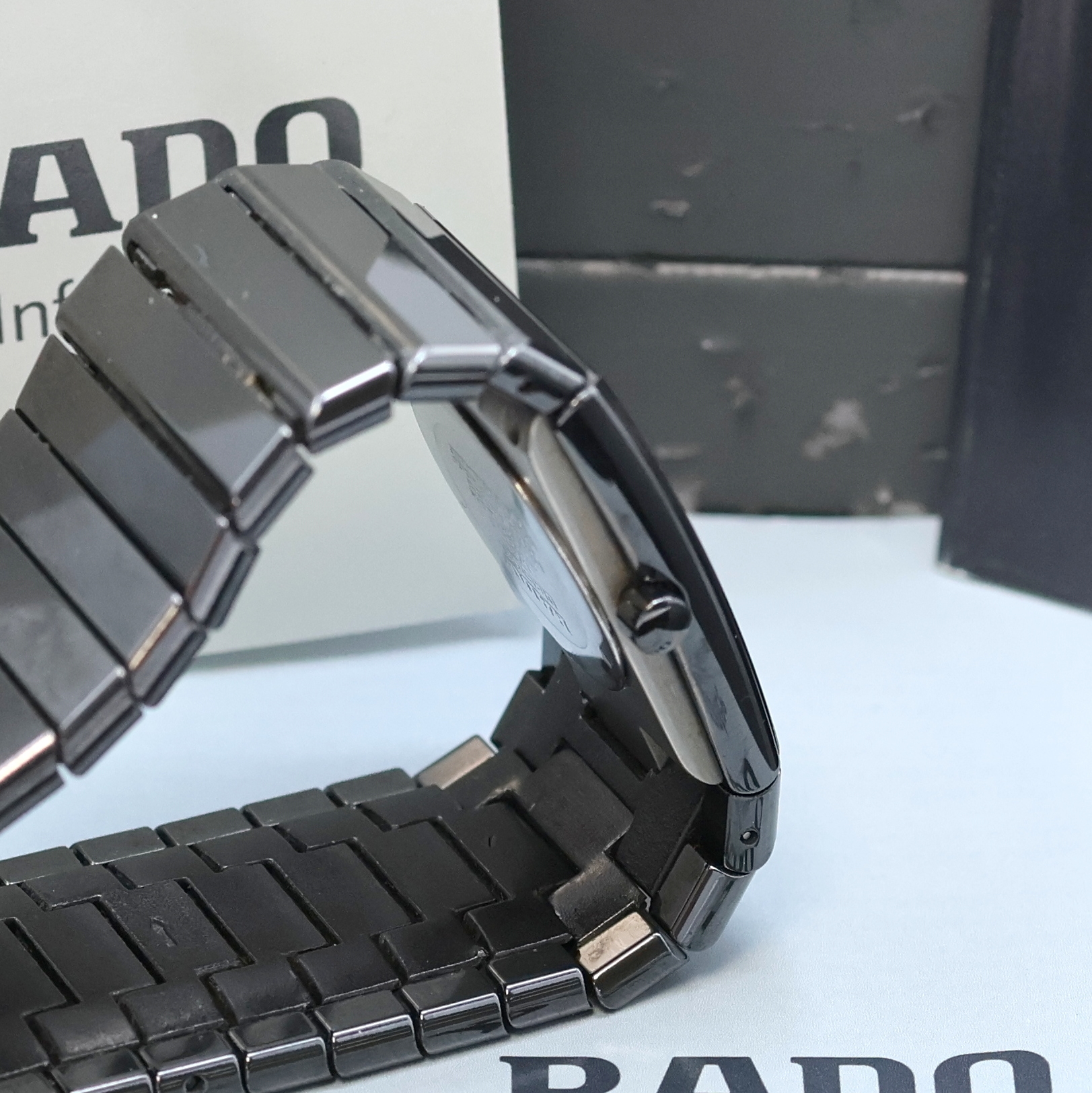 Detail c: RADO Diastar Armbanduhr Referenz 111.0348.3, Schweiz verk. lt. beil. Pap. 12/1993, quarz, Keramikgeh. inkl. Keramik-Gliederband m. dopp. ...