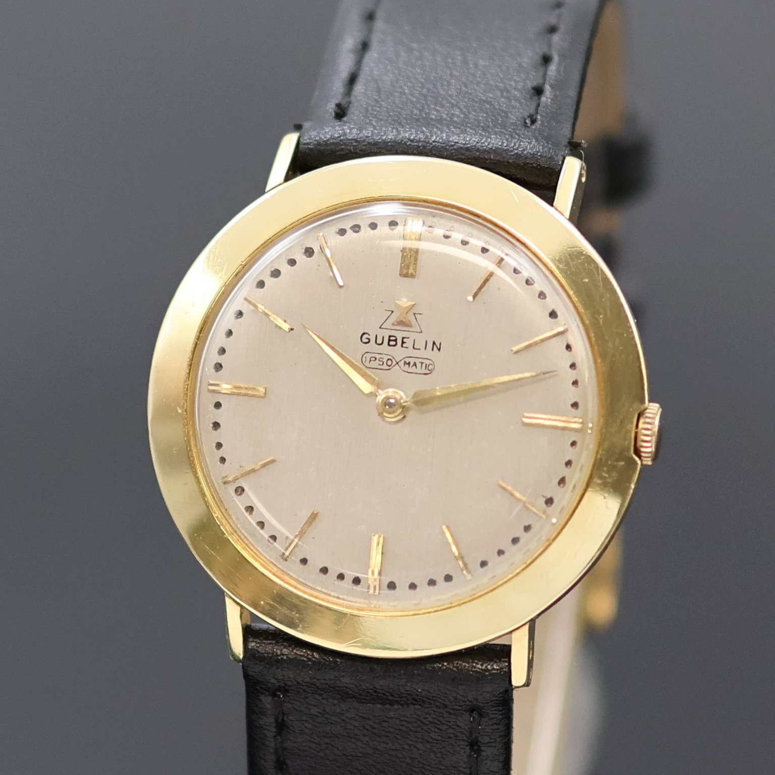 Detail a: GÜBELIN Ipsomatic Armbanduhr in GG 750/000, Schweiz um 1955, Handaufzug, Boden u. Glasrand gedr., silb. Zifferbl. rest., gold. Std.-Ind. u. Zeiger, ...
