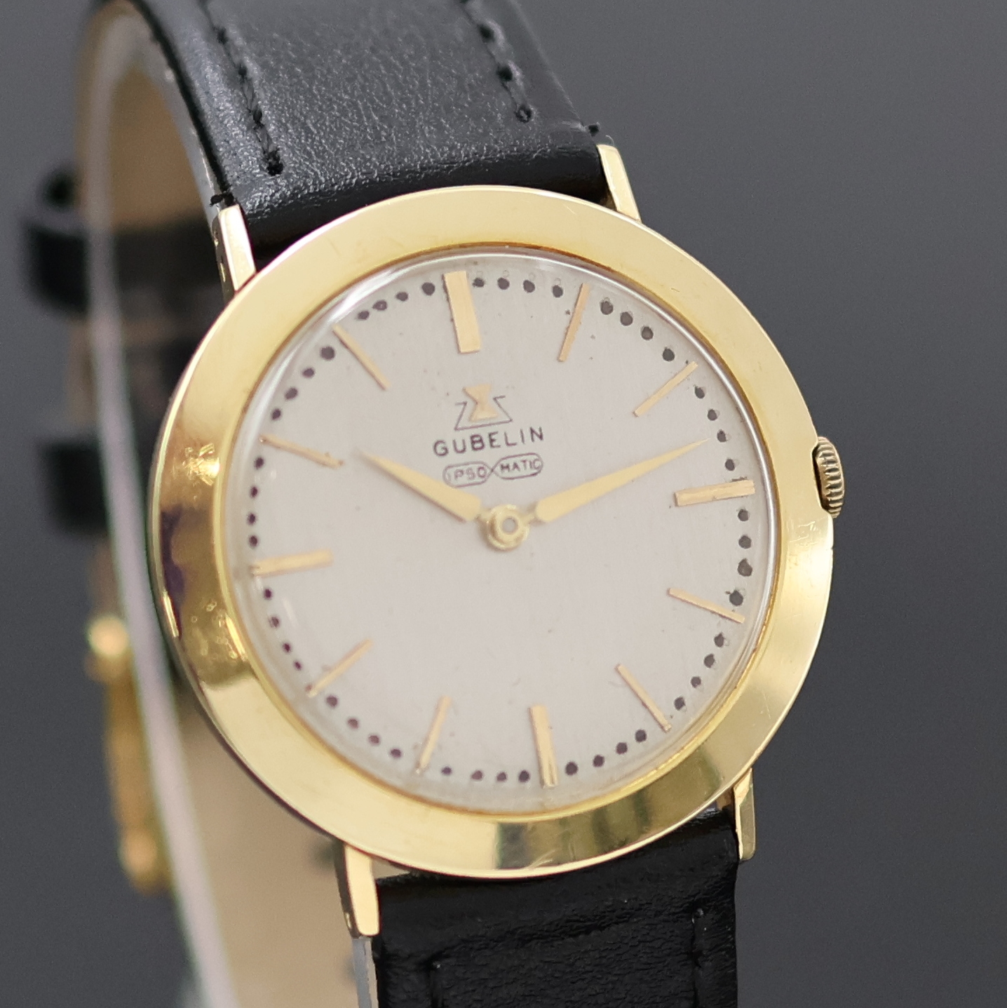 Detail b: GÜBELIN Ipsomatic Armbanduhr in GG 750/000, Schweiz um 1955, Handaufzug, Boden u. Glasrand gedr., silb. Zifferbl. rest., gold. Std.-Ind. u. Zeiger, ...