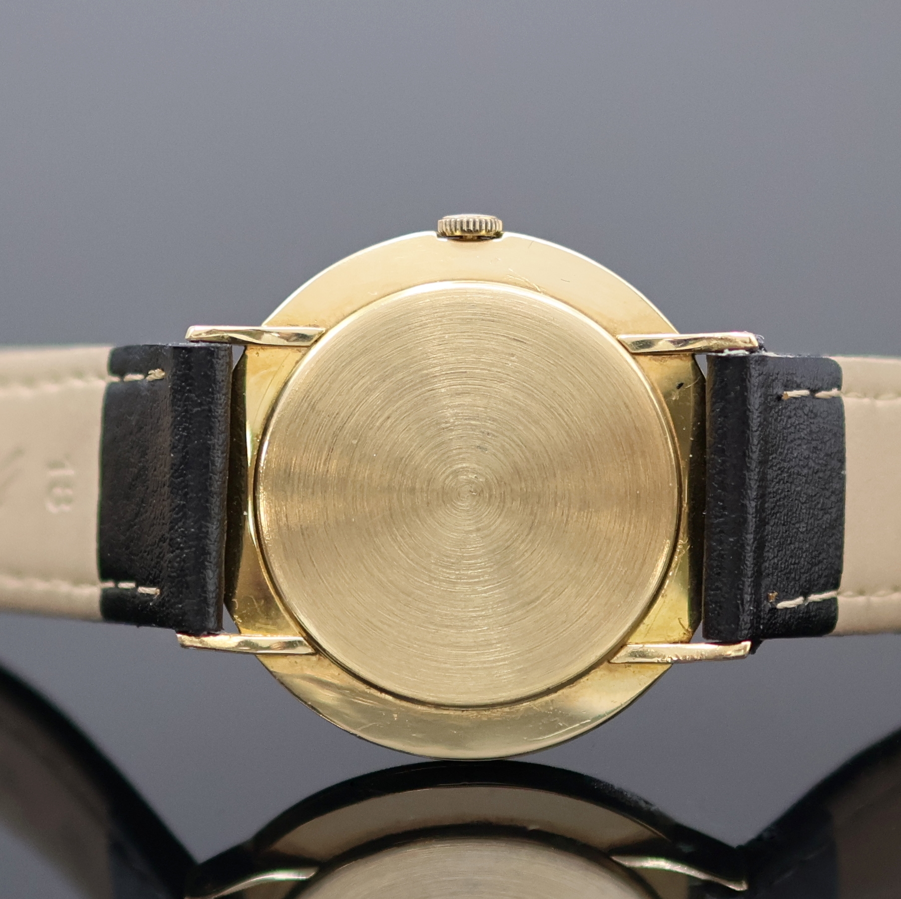 Detail d: GÜBELIN Ipsomatic Armbanduhr in GG 750/000, Schweiz um 1955, Handaufzug, Boden u. Glasrand gedr., silb. Zifferbl. rest., gold. Std.-Ind. u. Zeiger, ...