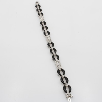 27053094b - Armband im Art Deco Stil mit Onyxen und Diamanten, WG 750/000, Diam. zus. ca. 1.20 ct ...