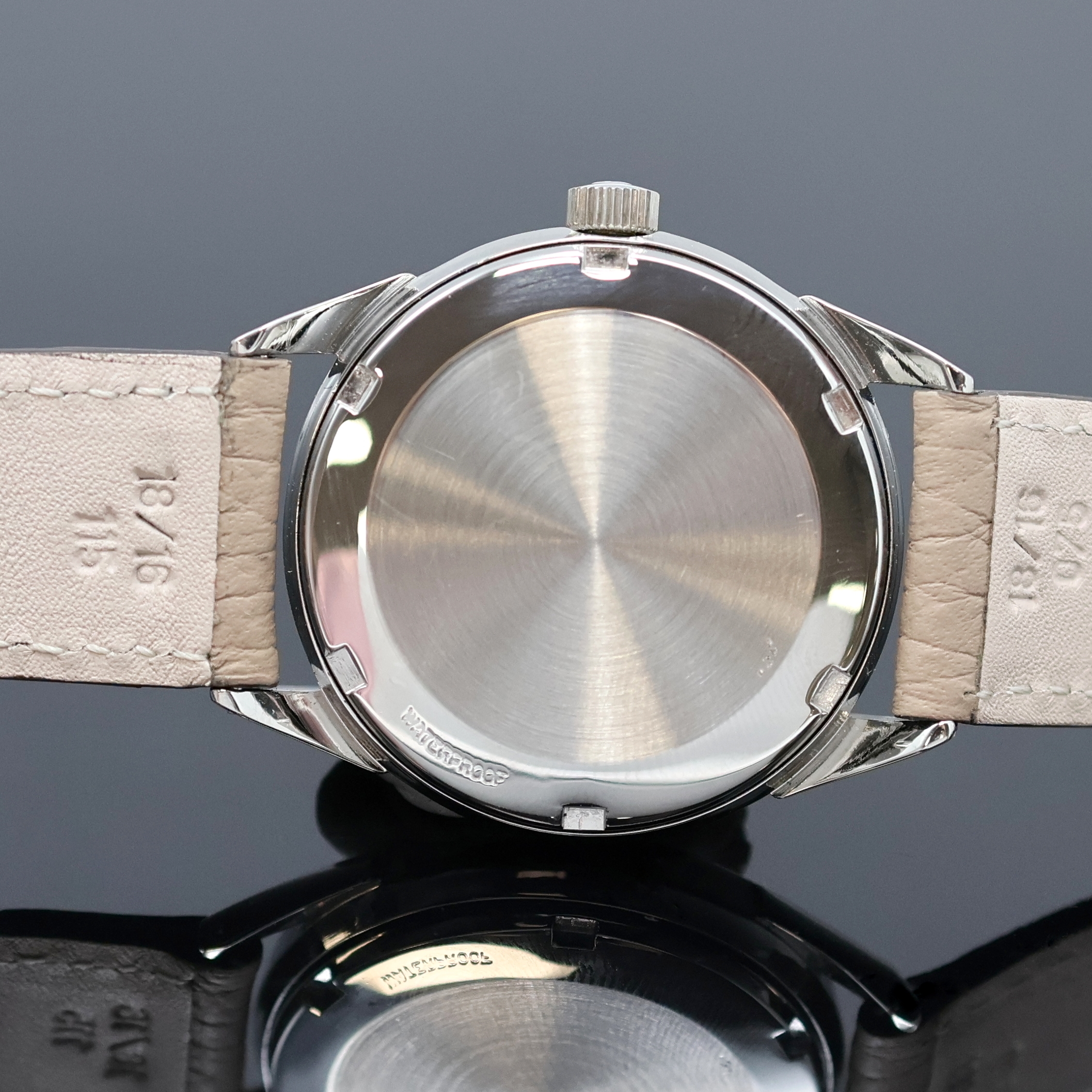 Detail e: TISSOT Seastar Armbanduhr in Stahl, Schweiz 1950er Jahre, Automatik, Boden verschr., silb. Zifferbl. pat./fl., aufges. Std.-Ind., silb. Zeiger, Kal. ...