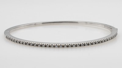 27055138a - Armreif mit Brillanten, WG 750/000, 57 Brill. zus. ca. 0.46 ct Weiß/si, Kastenschl. m. ...