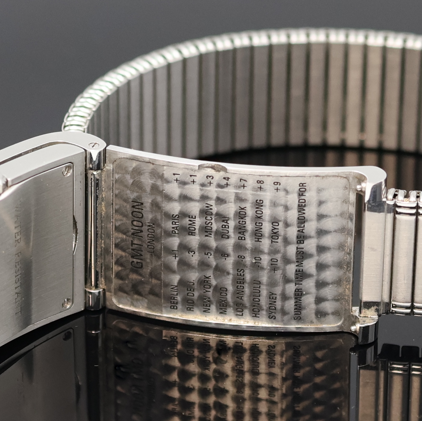 Detail c: CORUM Armbanduhr Serie Tabogan Referenz 64.151.20, Schweiz um 2000, quarz, Edelstahlgeh. inkl. neutr. Flexband, Oberteil zur Zeigerst. aufklappbar, ...