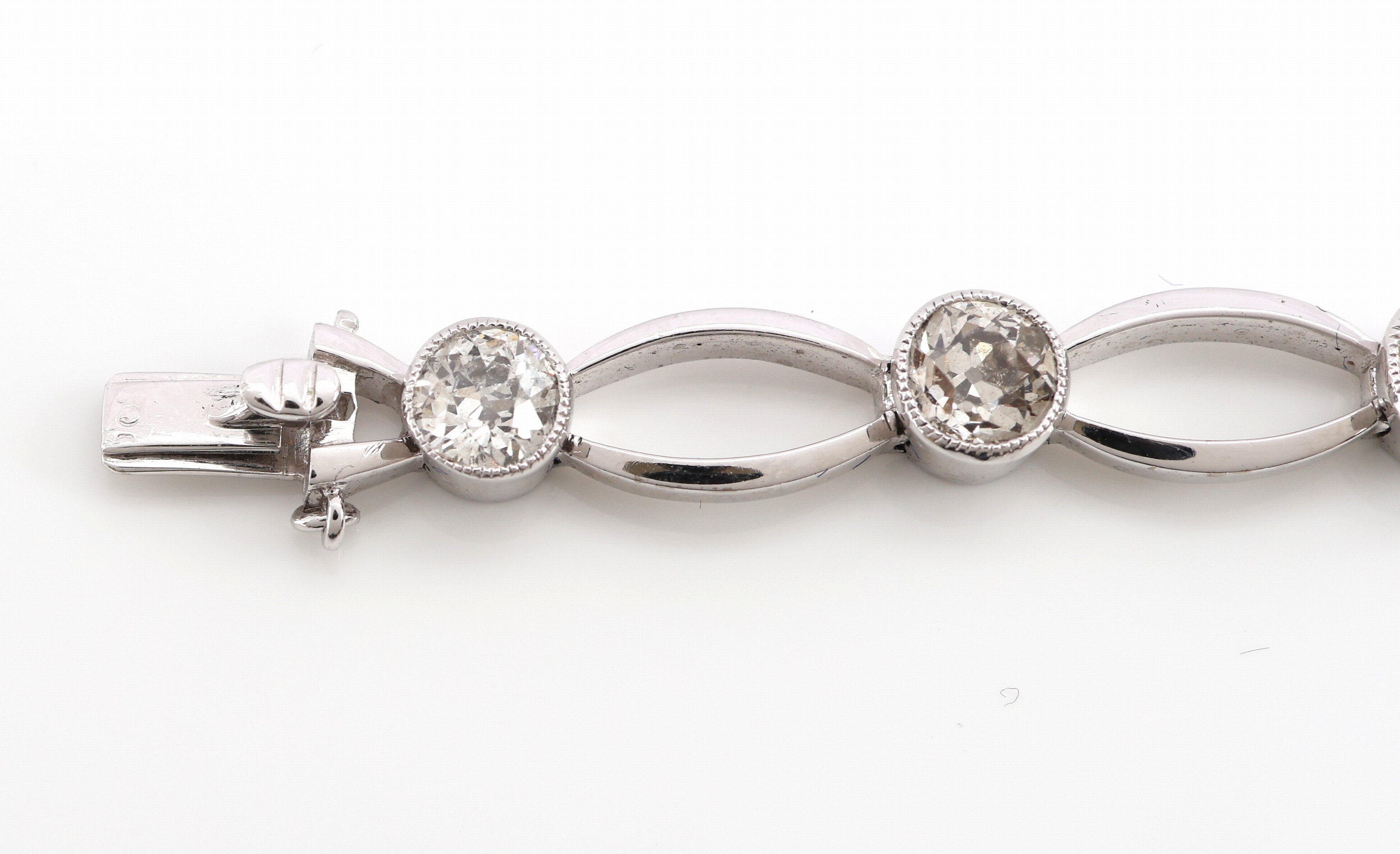 Detail b: 14 kt Gold Art Deco Diamant-Armband, um 1920- 30, WG 585/000 gepr., 9 Altschliffdiamantenzus. ca. 3.45 ct Weiß-get.Weiß/p, 3 Glieder bes. mit ...