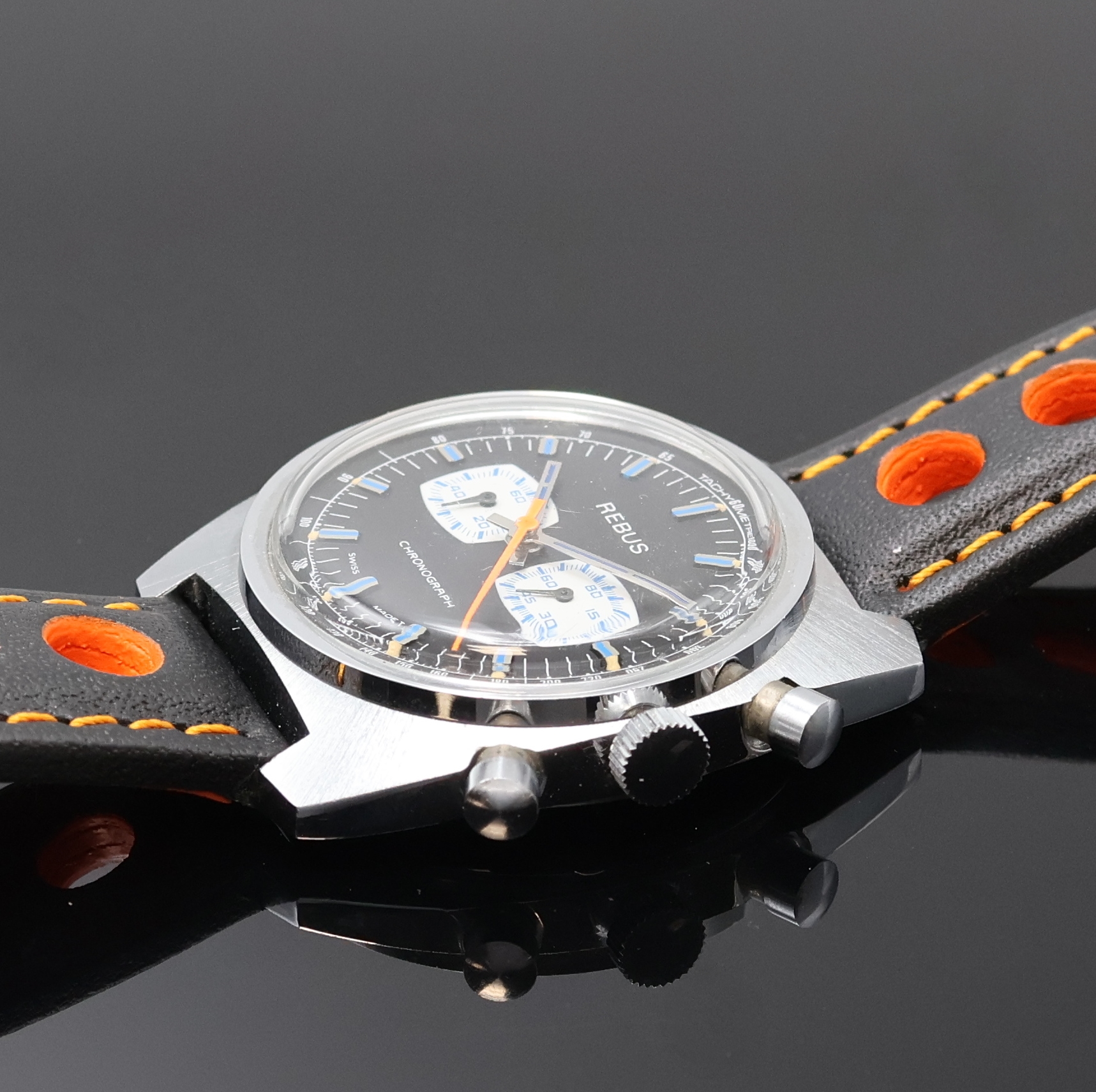 Detail c: REBUS Armbandchronograph, Handaufzug, Schweiz um 1970, verschr. Geh., Stahlboden aufgedr., schwarzes Zifferbl. m. aufgel. Indizes und ...