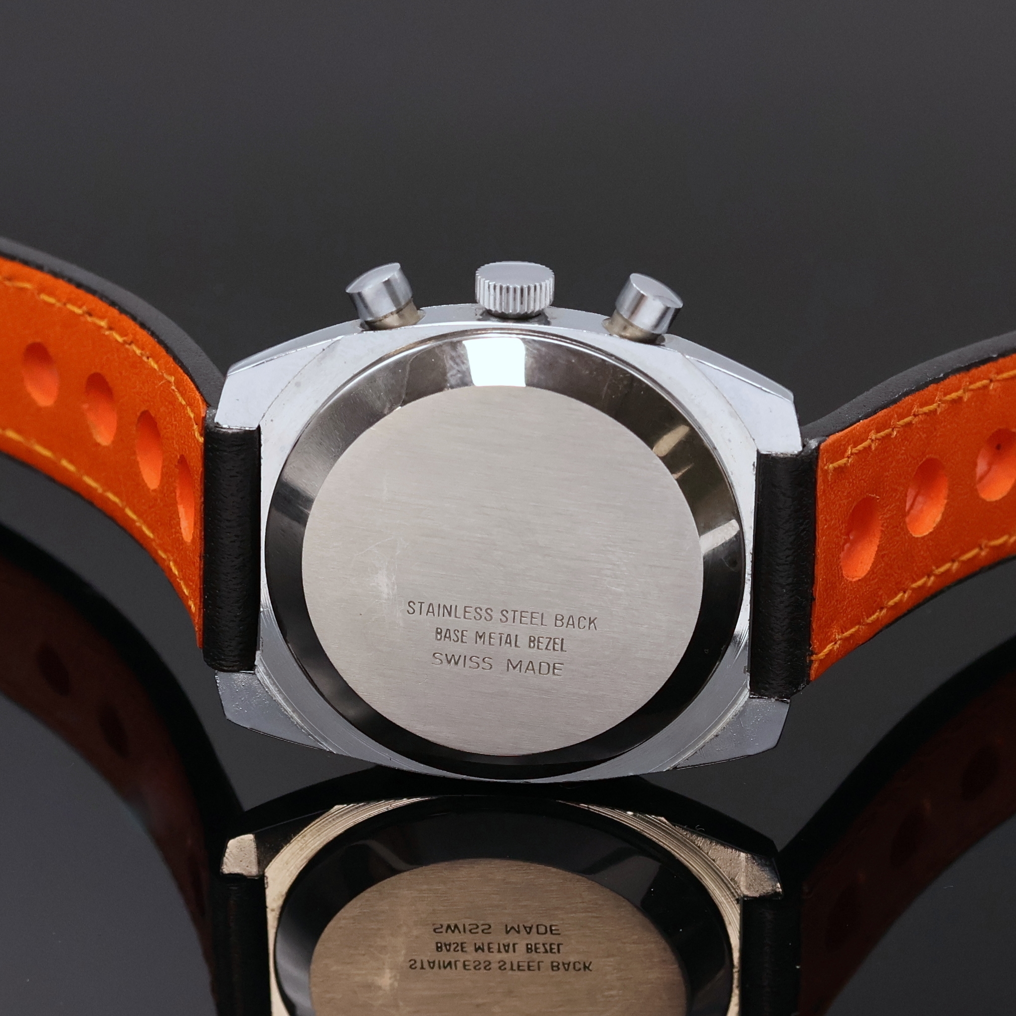 Detail d: REBUS Armbandchronograph, Handaufzug, Schweiz um 1970, verschr. Geh., Stahlboden aufgedr., schwarzes Zifferbl. m. aufgel. Indizes und ...