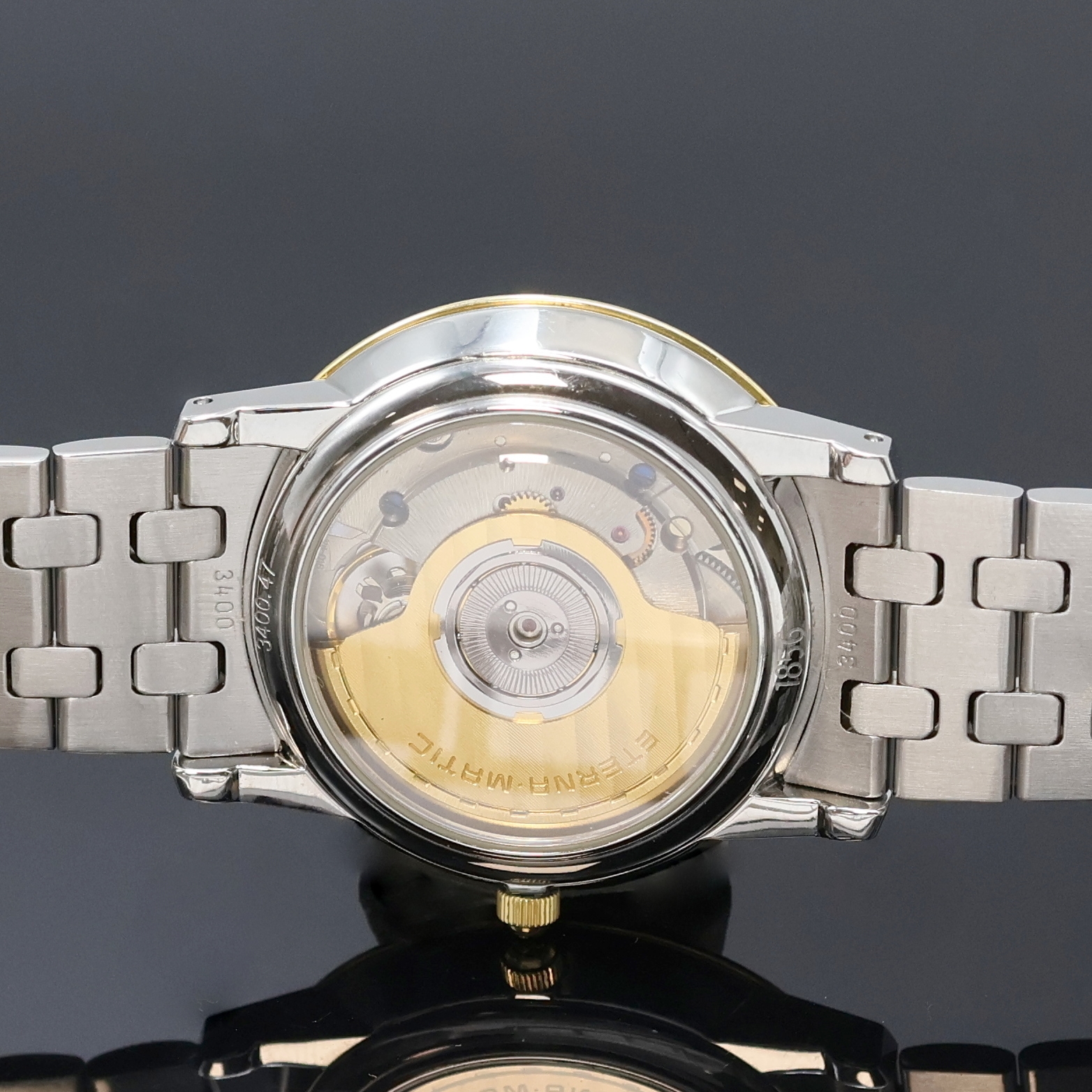 Detail e: ETERNA 1856 Armbanduhr Referenz 3400.47, Automatik, Schweiz um 1990, beids. vergl., z. T. verg. Edelstahlgeh. inkl. Gliederband m. dopp. Faltschl., ...