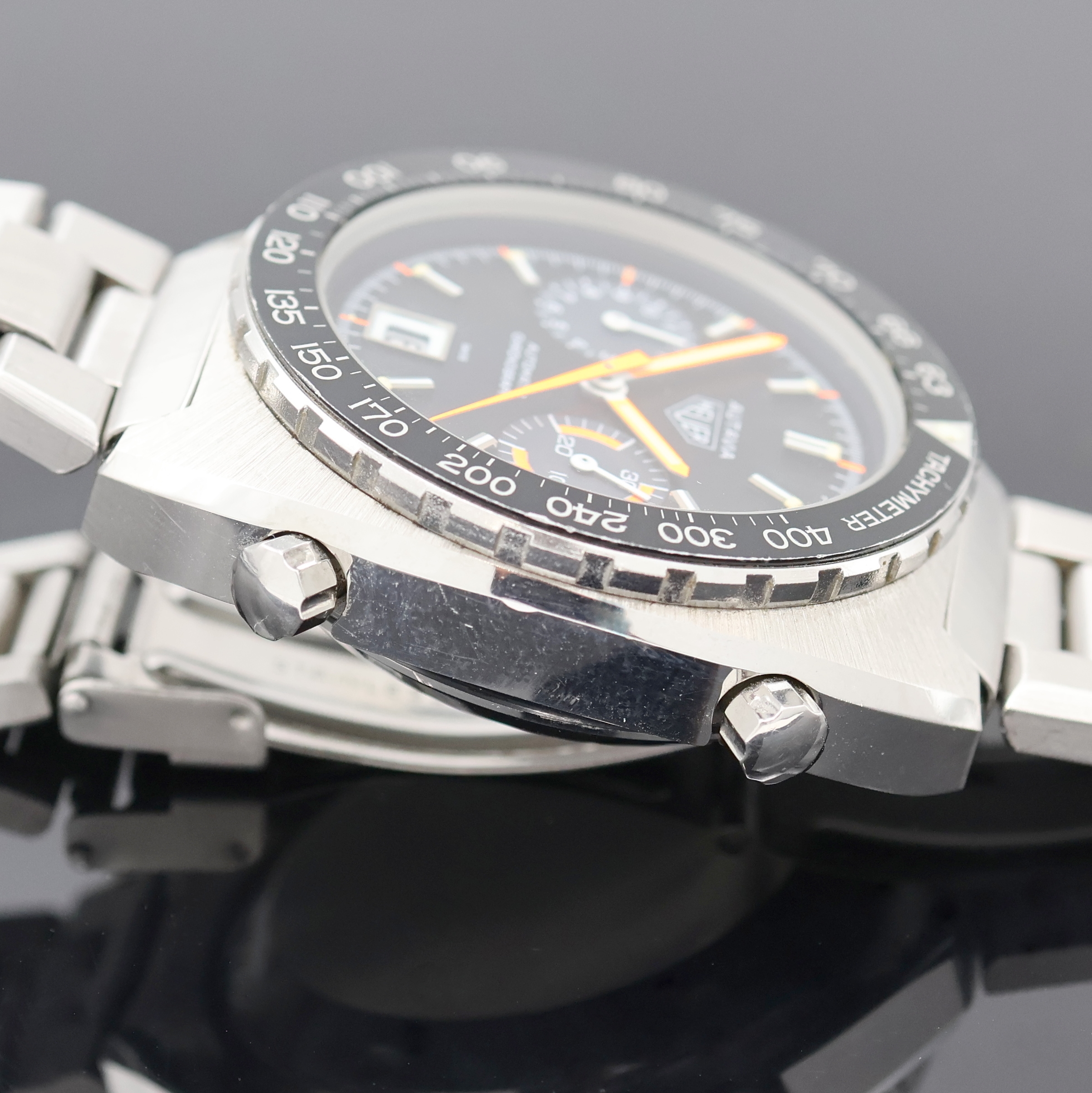 Detail e: HEUER Autavia "Orange Boy" seltener Armbandchronograph Referenz 11630, Automatik, Schweiz um 1975, Edelstahlgeh. inkl. orig. Gliederband m. ...