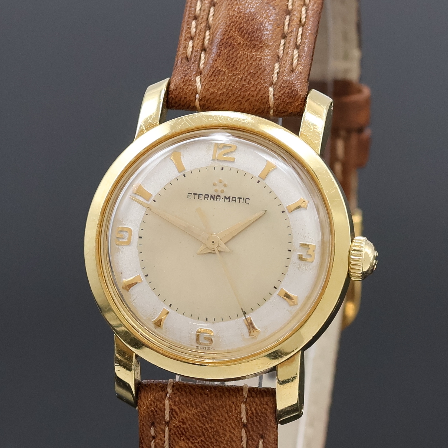 Detail a: ETERNA MATIC Herrenarmbanduhr in GG 585/000, Schweiz um 1950, Automatik, 2-teil. Geh., Boden verschr., silb. Duoton-Zifferbl., gold. Indizes und ...