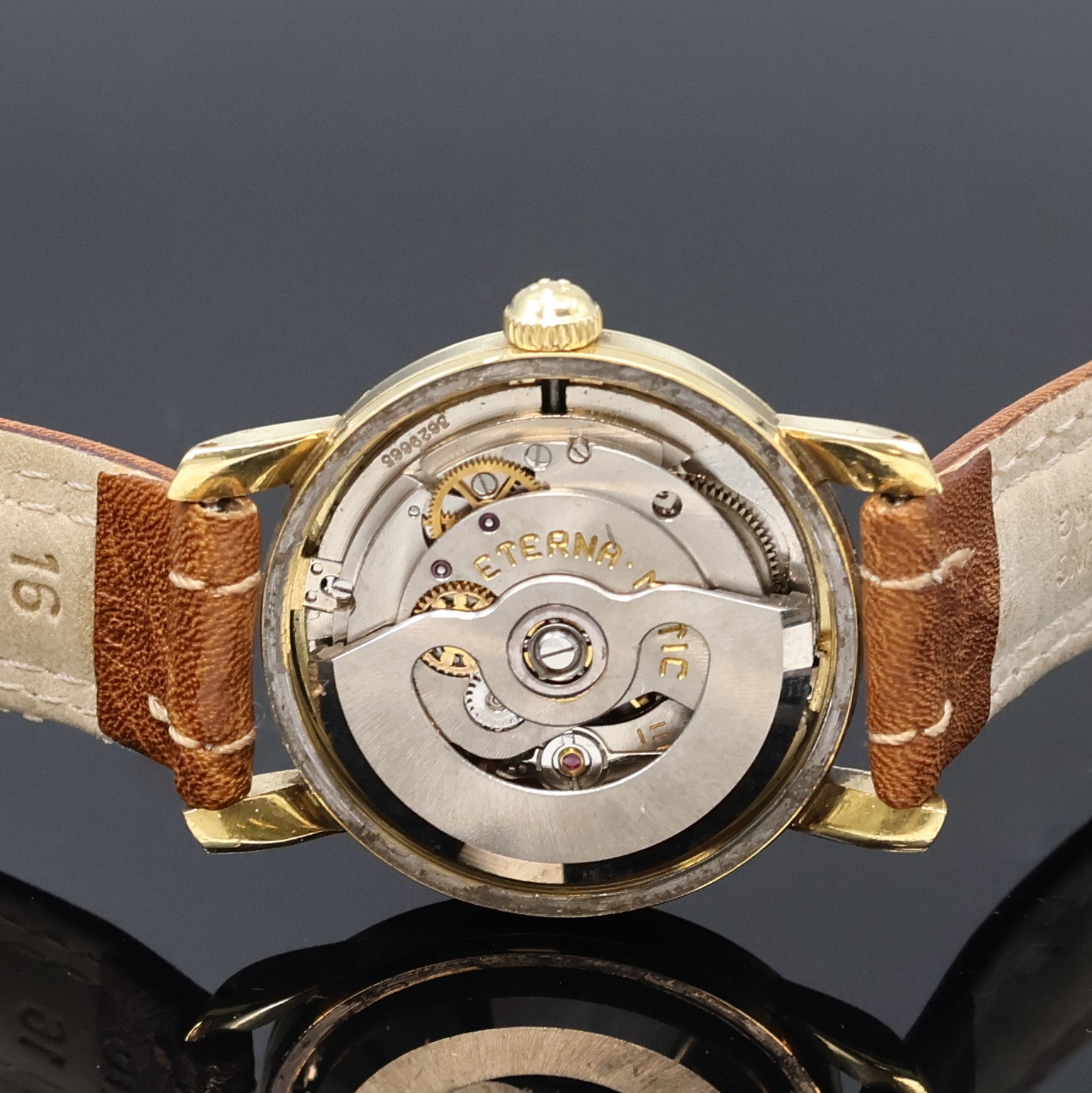 Detail d: ETERNA MATIC Herrenarmbanduhr in GG 585/000, Schweiz um 1950, Automatik, 2-teil. Geh., Boden verschr., silb. Duoton-Zifferbl., gold. Indizes und ...