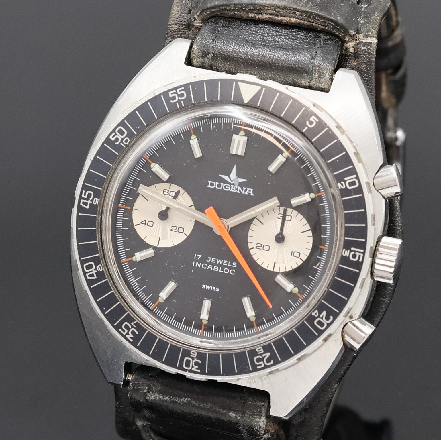 Detail a: DUGENA Armbandchronograph in Stahl, Schweiz um 1970, Handaufzug, Edelstahlgeh., Boden verschr., Lün. m. Std.- und Min.-Teilung beids. drehb., ...