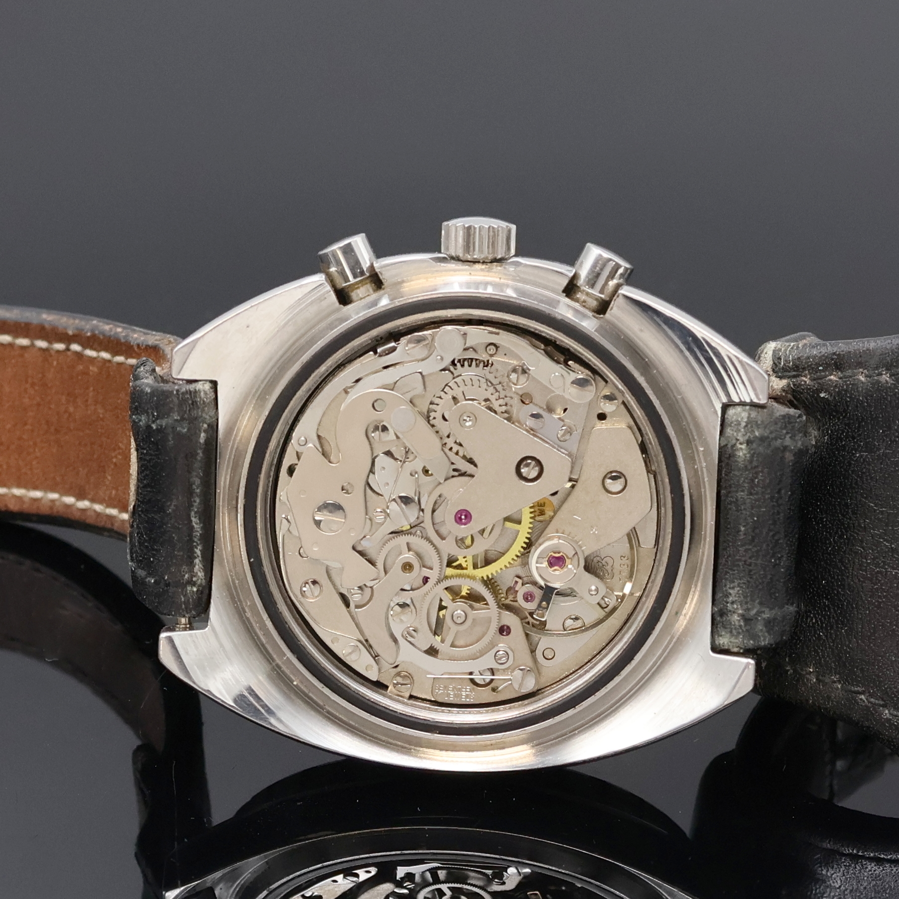 Detail d: DUGENA Armbandchronograph in Stahl, Schweiz um 1970, Handaufzug, Edelstahlgeh., Boden verschr., Lün. m. Std.- und Min.-Teilung beids. drehb., ...
