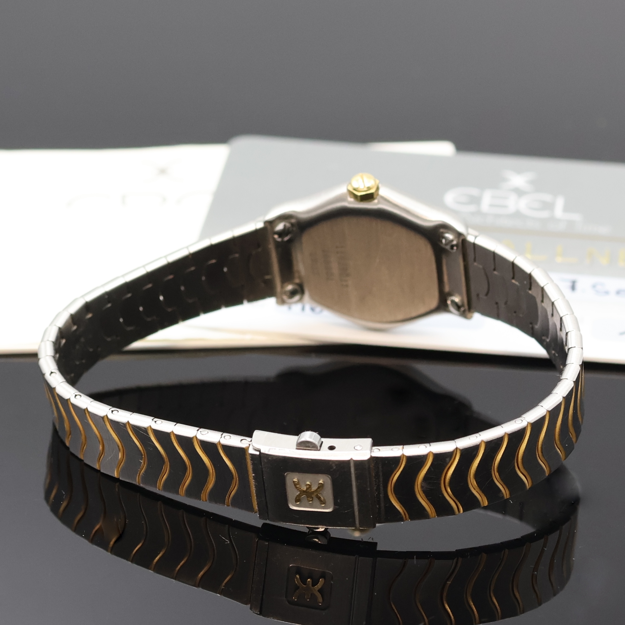 Detail b: EBEL Damenarmbanduhr in Stahl/Gold Referenz 166901, Schweiz um 1995, quartz, Monocoque- Geh., 5-fach verschr. GG 750/000 Lünette, orig. ...
