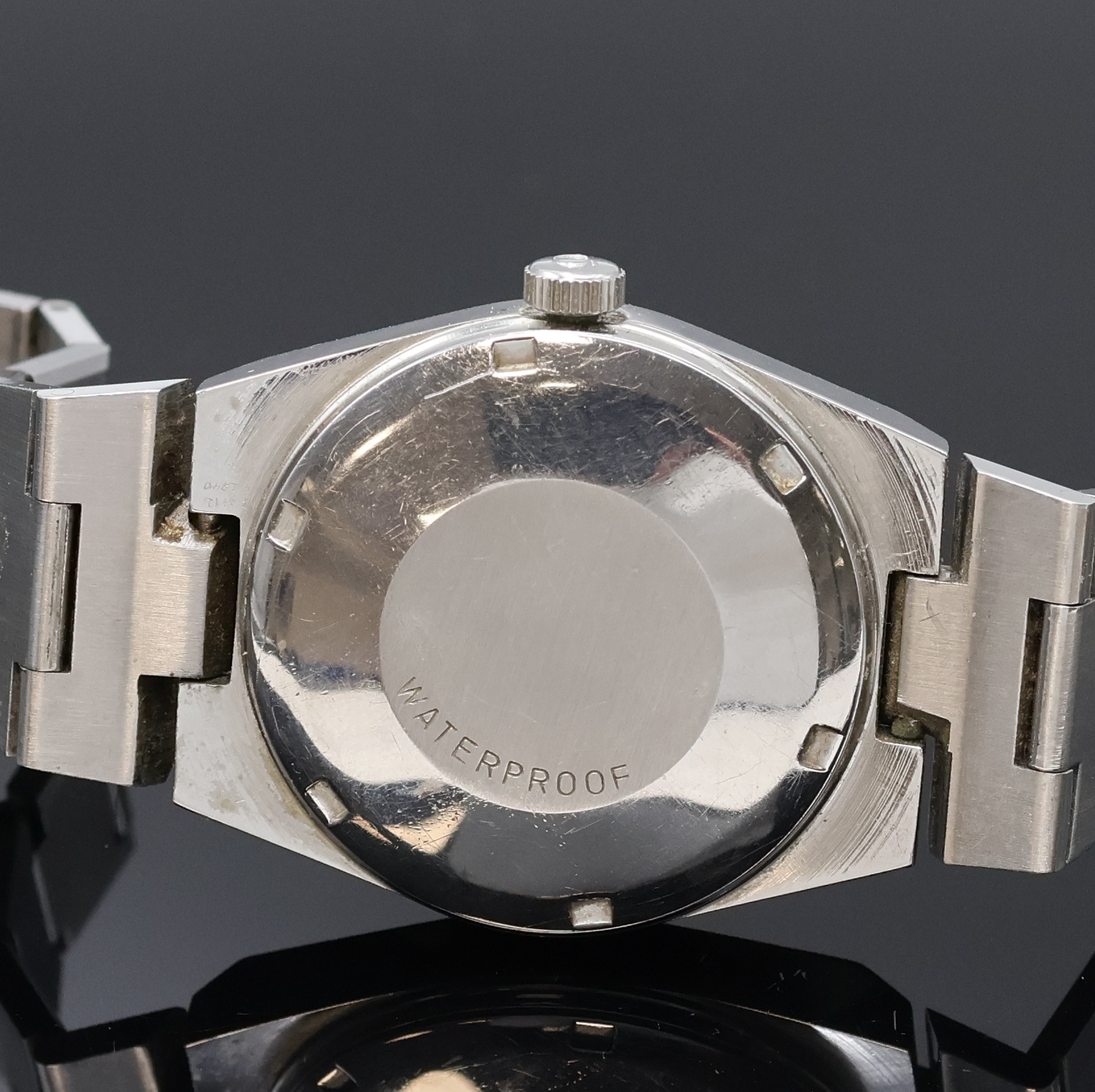 Detail d: OMEGA Geneve Herrenarmbanduhr in Stahl Referenz 166099, Schweiz um 1972, Automatik, verschr. Geh. am integr. Stahlband Ref. 1189/191, orig. Krone, ...