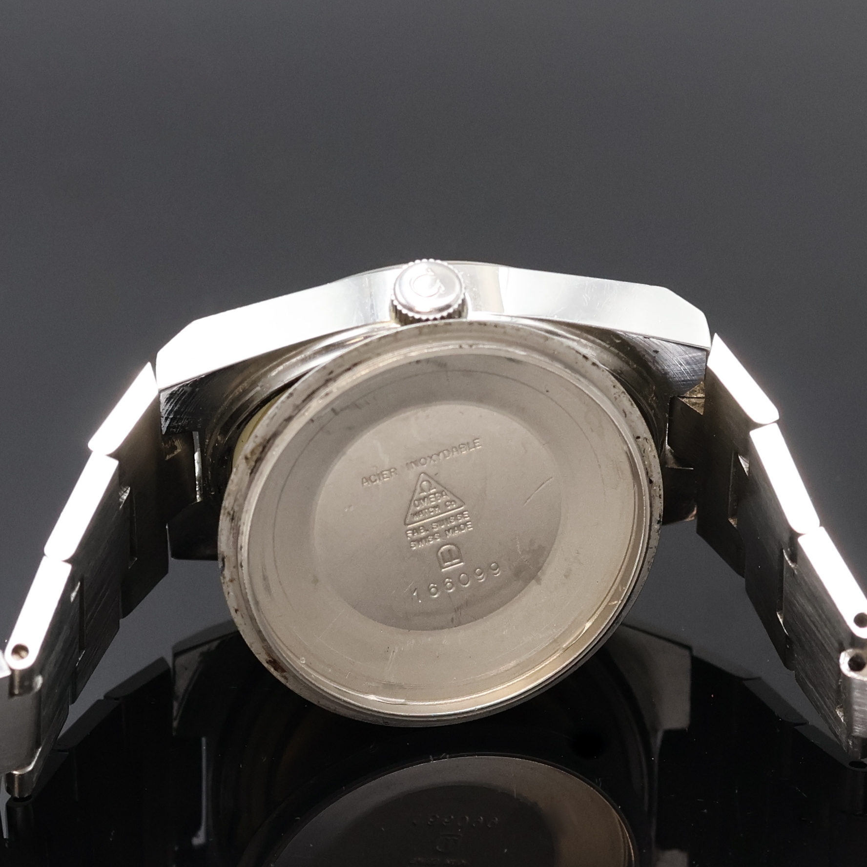 Detail g: OMEGA Geneve Herrenarmbanduhr in Stahl Referenz 166099, Schweiz um 1972, Automatik, verschr. Geh. am integr. Stahlband Ref. 1189/191, orig. Krone, ...