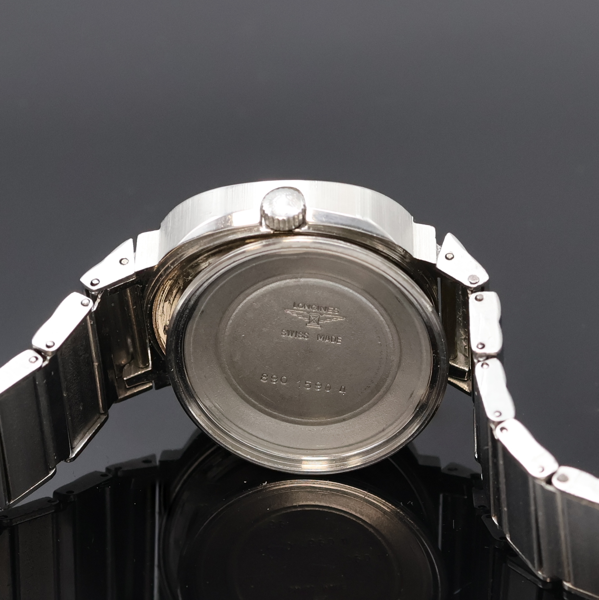Detail g: LONGINES Herrenarmbanduhr in Stahl/Stahlband, Schweiz um 1972, Automatik, verschr. TV- Screen-Geh., orig. Krone, silb. Zifferbl. fl., silb. Indizes ...