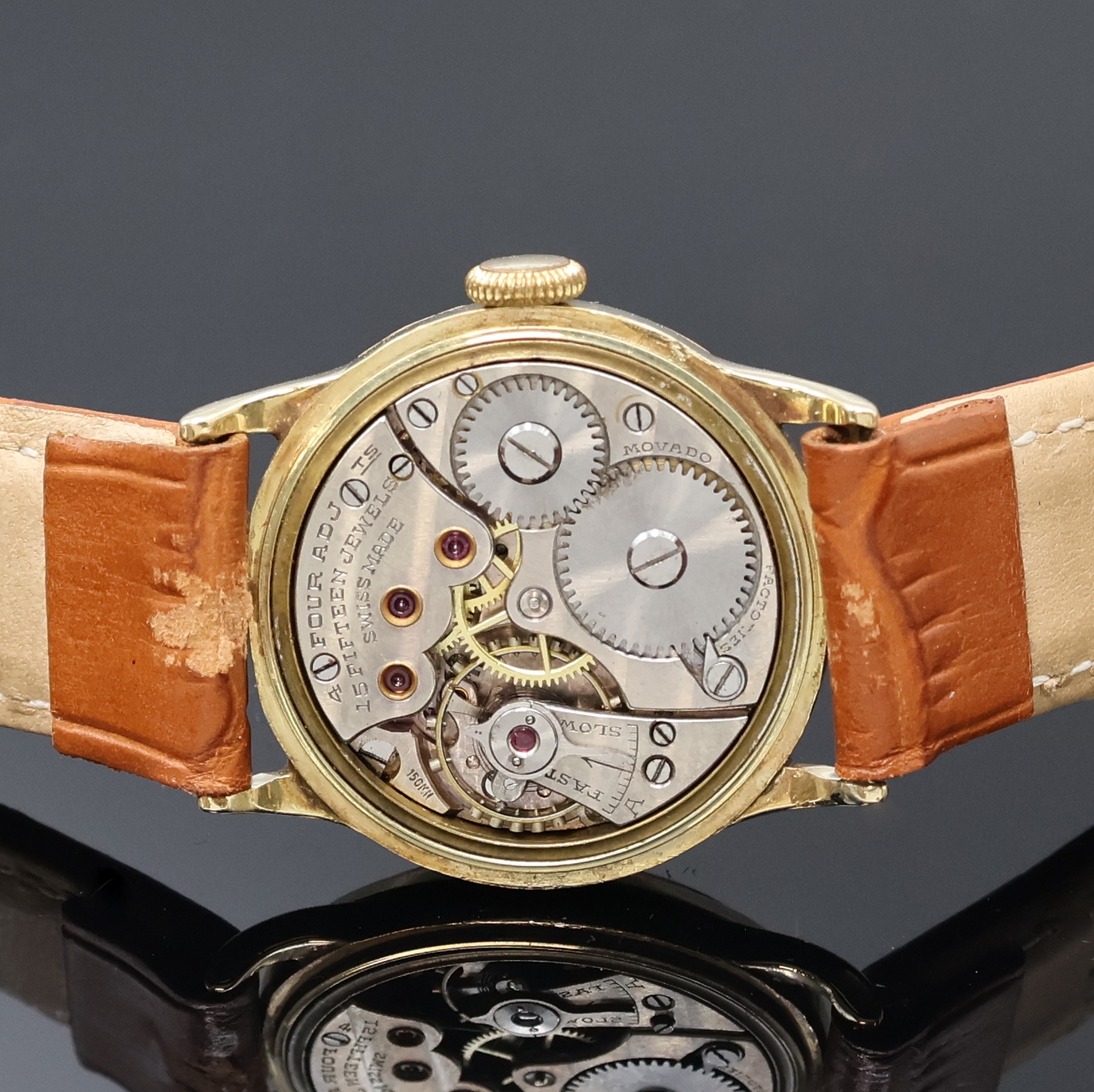 Detail d: MOVADO Chronometre Armbanduhr in GG 585/000, Schweiz um 1935, Handaufzug, 3-tlg. Geh., Boden m. Widmungsgrav. u. Glasrand aufgedr., silb. Zifferbl. ...