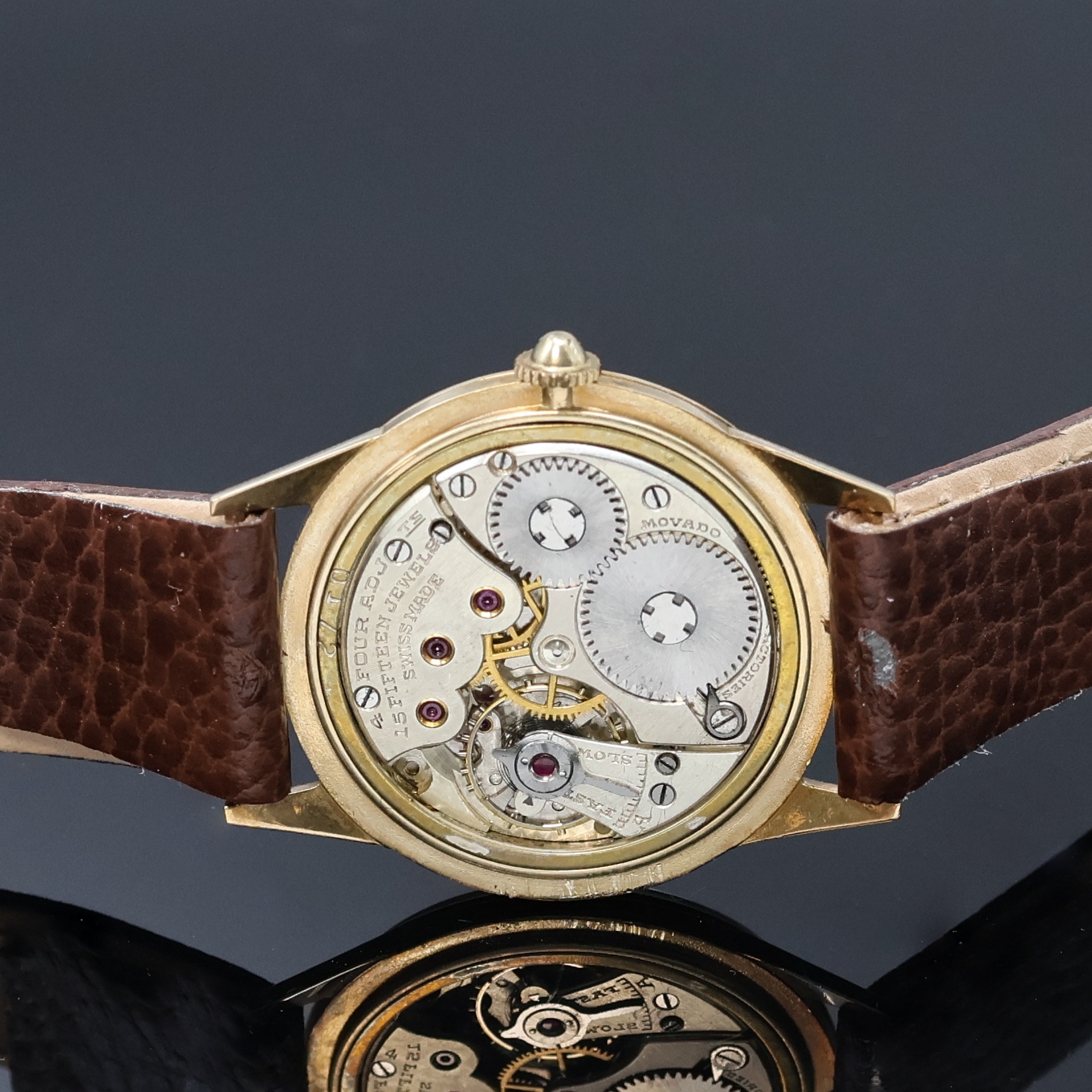 Detail c: MOVADO Armbanduhr in GG 375/000, Schweiz um 1935, Handaufzug, 3-tlg. Geh., Boden u. Glasrand aufgedr., silb. Zifferbl. m. Breguetzahlen rest., gold. ...