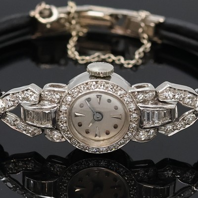 27059092a - Diamantbesetzte Damenarmbanduhr in Platin/ Iridium mit Schließe in WG 585/000, Schweiz ...