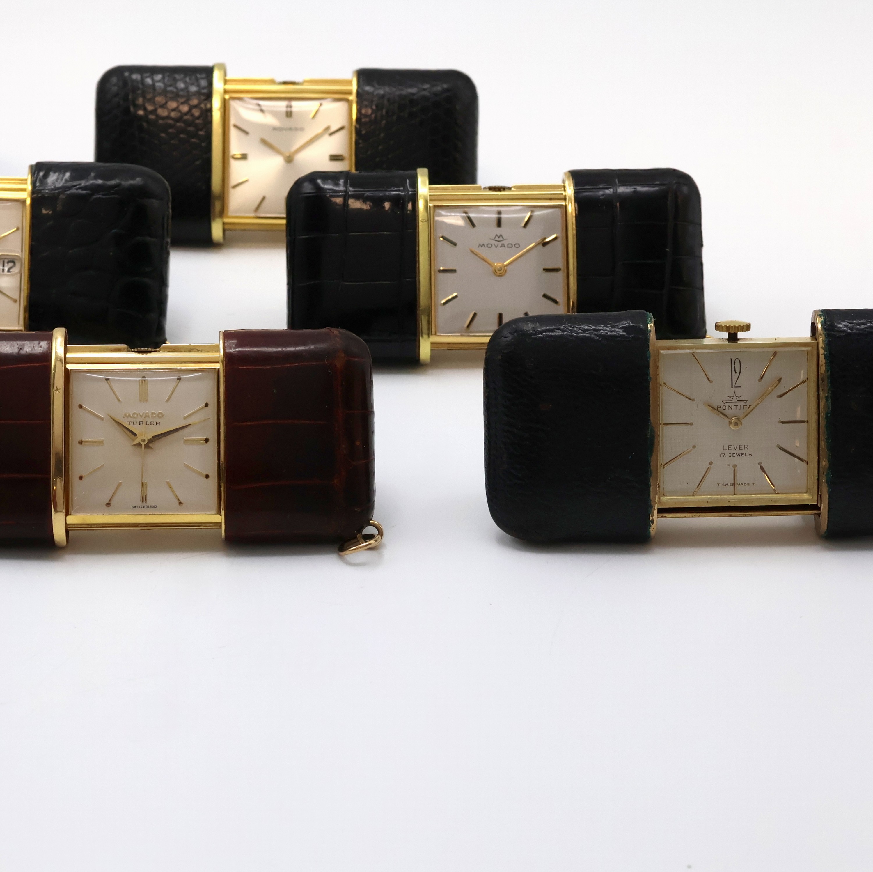 Detail a: 5 MOVADO ERMETO und 1 Pontifa Schiebeuhr, Schweiz um 1930 - 1960, 1 x Handaufzug, 5 x Schiebeaufzug, verg., Leder-bezogene Geh., silb. Zifferbl., 5 x ...