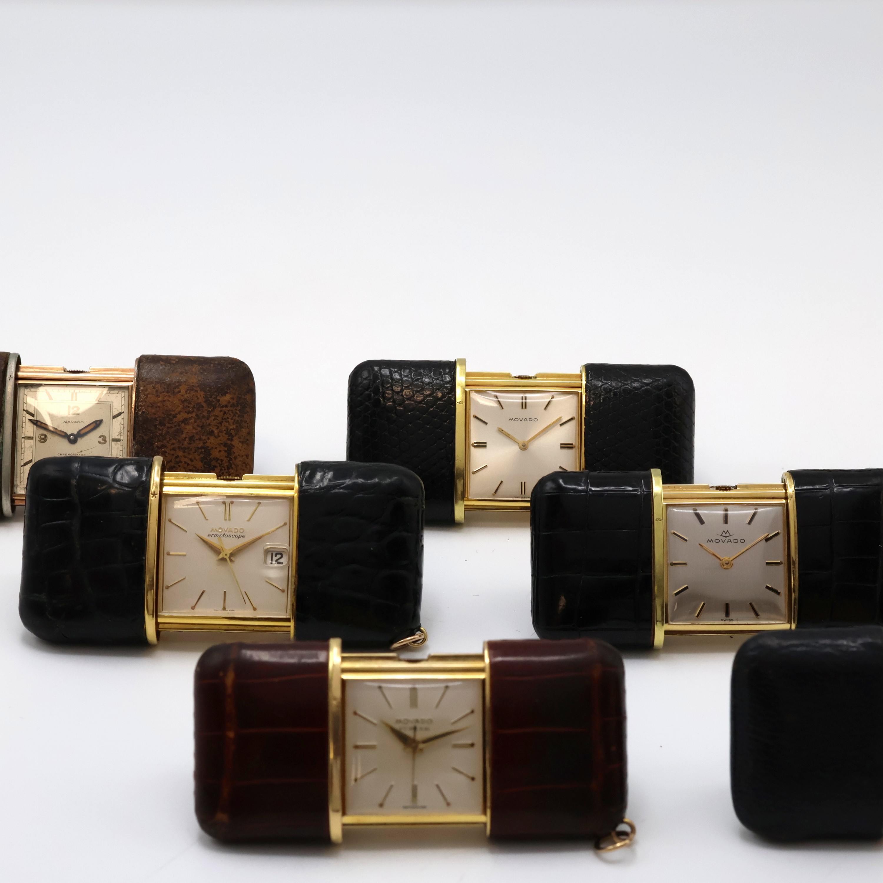Detail b: 5 MOVADO ERMETO und 1 Pontifa Schiebeuhr, Schweiz um 1930 - 1960, 1 x Handaufzug, 5 x Schiebeaufzug, verg., Leder-bezogene Geh., silb. Zifferbl., 5 x ...