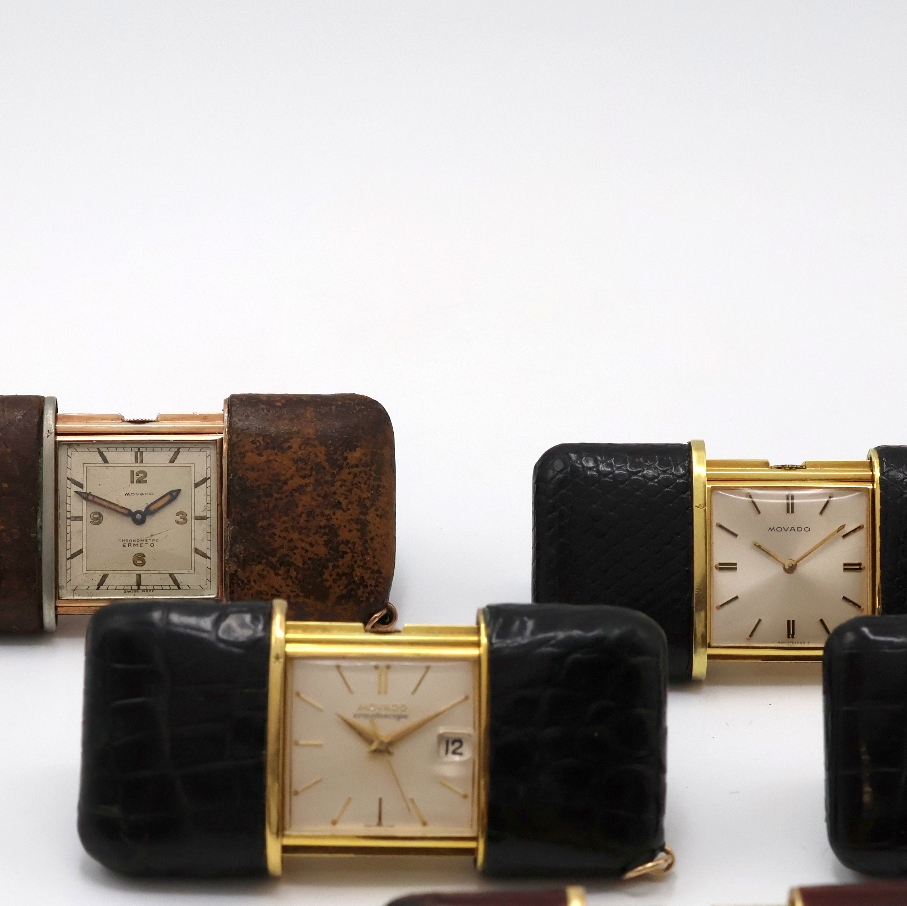 Detail c: 5 MOVADO ERMETO und 1 Pontifa Schiebeuhr, Schweiz um 1930 - 1960, 1 x Handaufzug, 5 x Schiebeaufzug, verg., Leder-bezogene Geh., silb. Zifferbl., 5 x ...
