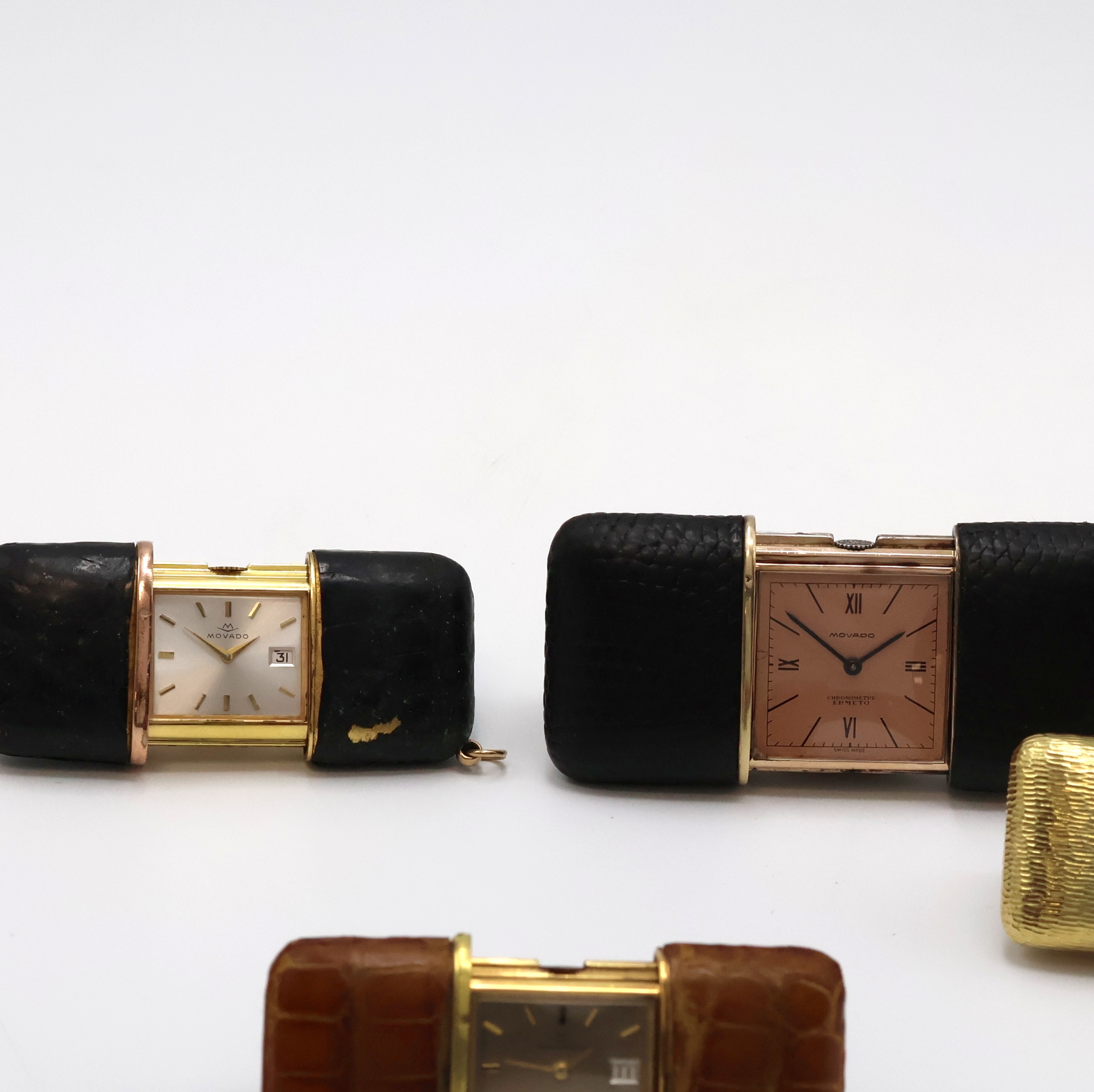 Detail c: 4 Movado ERMETO vergoldete Schiebeührchen, Schweiz um 1930 - 1960, Schiebeaufzug, verg. Geh., 3 x Leder-bezogen, 1 x verg. m. Borken-Struktur, 1 x ...