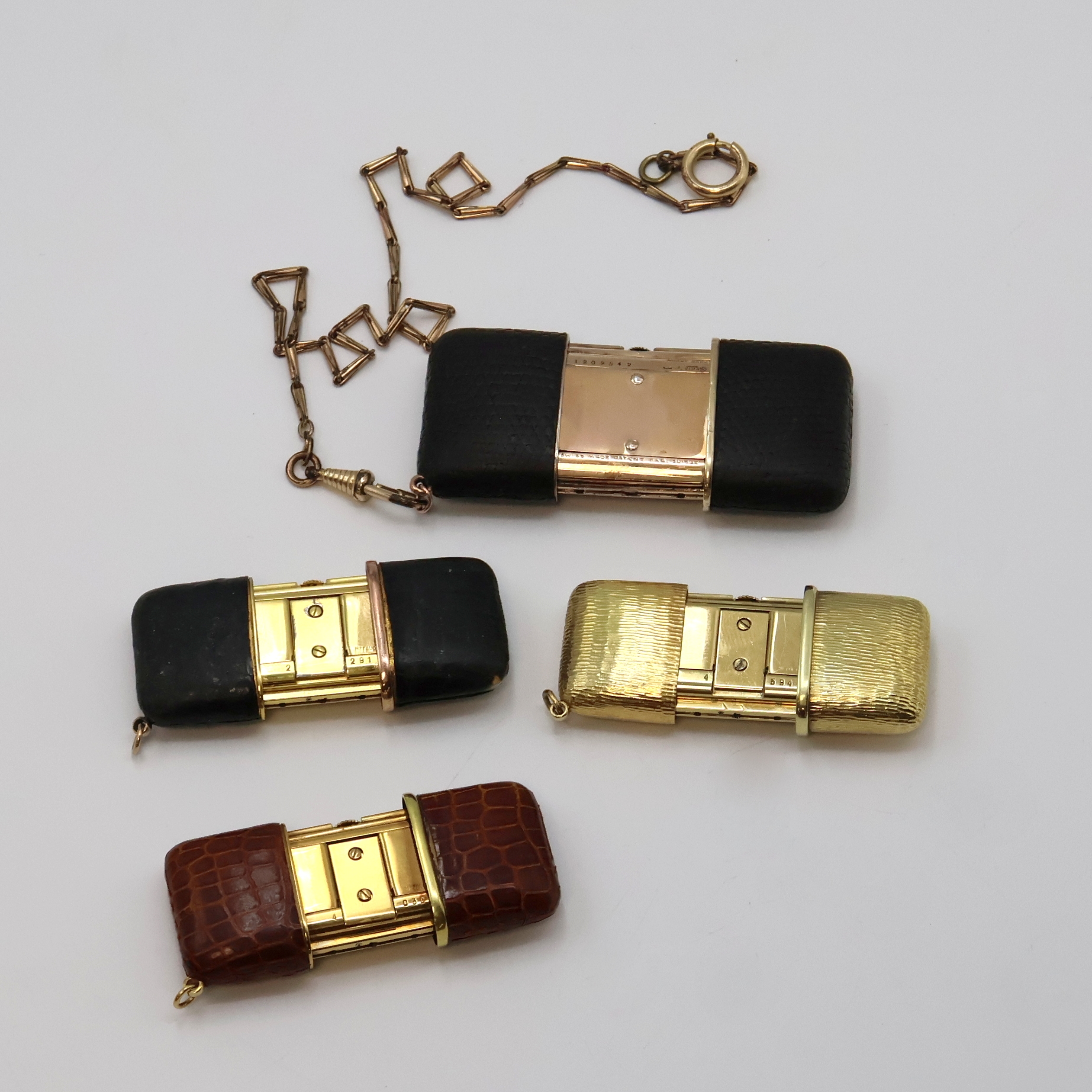 Detail e: 4 Movado ERMETO vergoldete Schiebeührchen, Schweiz um 1930 - 1960, Schiebeaufzug, verg. Geh., 3 x Leder-bezogen, 1 x verg. m. Borken-Struktur, 1 x ...